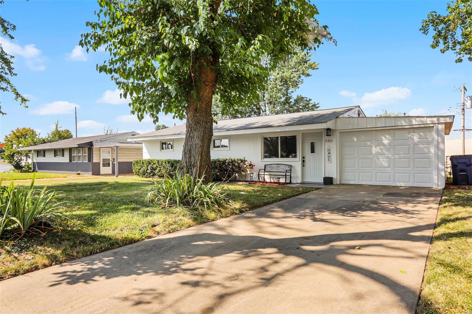 Such a Nice Affordable Home! Great Street Appeal! So Many Updates! New Front Door & Dusk to Dawn Light! Newer Garage Door!  Fresh Paint In & Out! Nice New Flooring Through Home! New Lighting! Updated Eat-In Kitchen w/42 inch White Cabinets, New Counters, Double Stainless Sink, Newer Stainless Appliances including Range and Microwave and Dishwasher, Breakfast Area & Sliding Door with Inlaid Blinds to Yard.  Laundry Accessible from Kitchen. Updated Bathroom with Tasteful Decorative Tile Work and New Tall Vanity, White 6 Panel Doors, Doors with Lever Handles, Updated Insulated Windows. Oversized Garage with Access to House and Storage Area behind Garage. Updated Electric Panel. Concrete Driveway, 3 Bedrooms including Primary Bedroom with 3 Closets. New Flooring in Bedrooms inc New Carpet in 3rd Bedroom.  Large Level Fenced Yard.  Fresh, Clean & Move In Ready! Woodson Terrace Municipality w/Park, Playground, Pool and Community Center. Central Location. Minutes to the Airport & Highway 70.