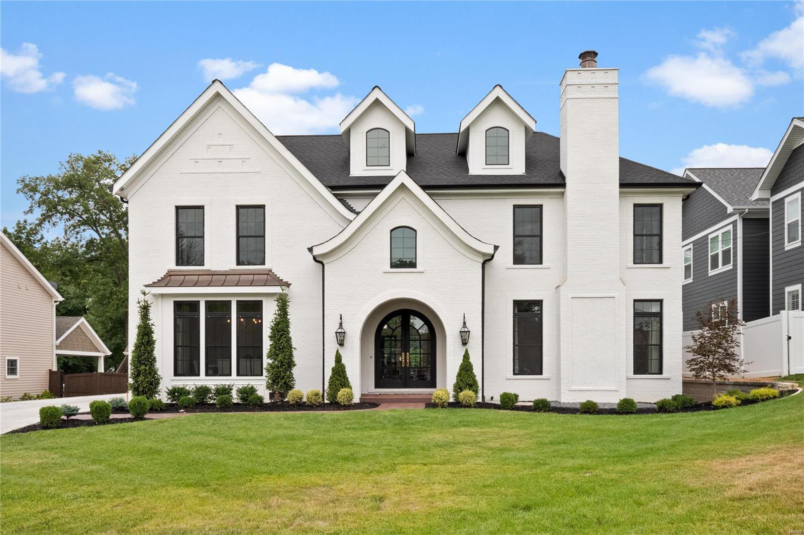 You’ve never seen a home like this in Kirkwood. This luxury estate home sits on 3/4 acre lot with a custom pool.  Walking distance to downtown kirkwood. Over 6000 sq ft with a carriage house and over 1500 of living area in lower level including bar, playroom, bed & bath. Enjoy lazy days on the covered patio with it’s cozy outdoor fireplace overlooking the parklike lot. Open floor plan, media room, 2nd floor laundry. Master Bed ensuite with custom closet, laundry & fireplace. Dramatic black framed floor to ceiling windows adorn each room with 7" wide white oak floors throughout. Spectacular coffered ceiling is present in great room & reclaimed wood beams accentuate the 16 ft vaulted ceiling in hearth room. Luxury kitchen has stunning Amish custom made cabinets. Appliances include a wolf dual fuel range, pot sink, sub zero fridge, wine fridge with beverage center below & Pellet ice machine. Quartz 10 x 6 island is where the party begins.  Sprinkler System. Additional Rooms: Mud Room