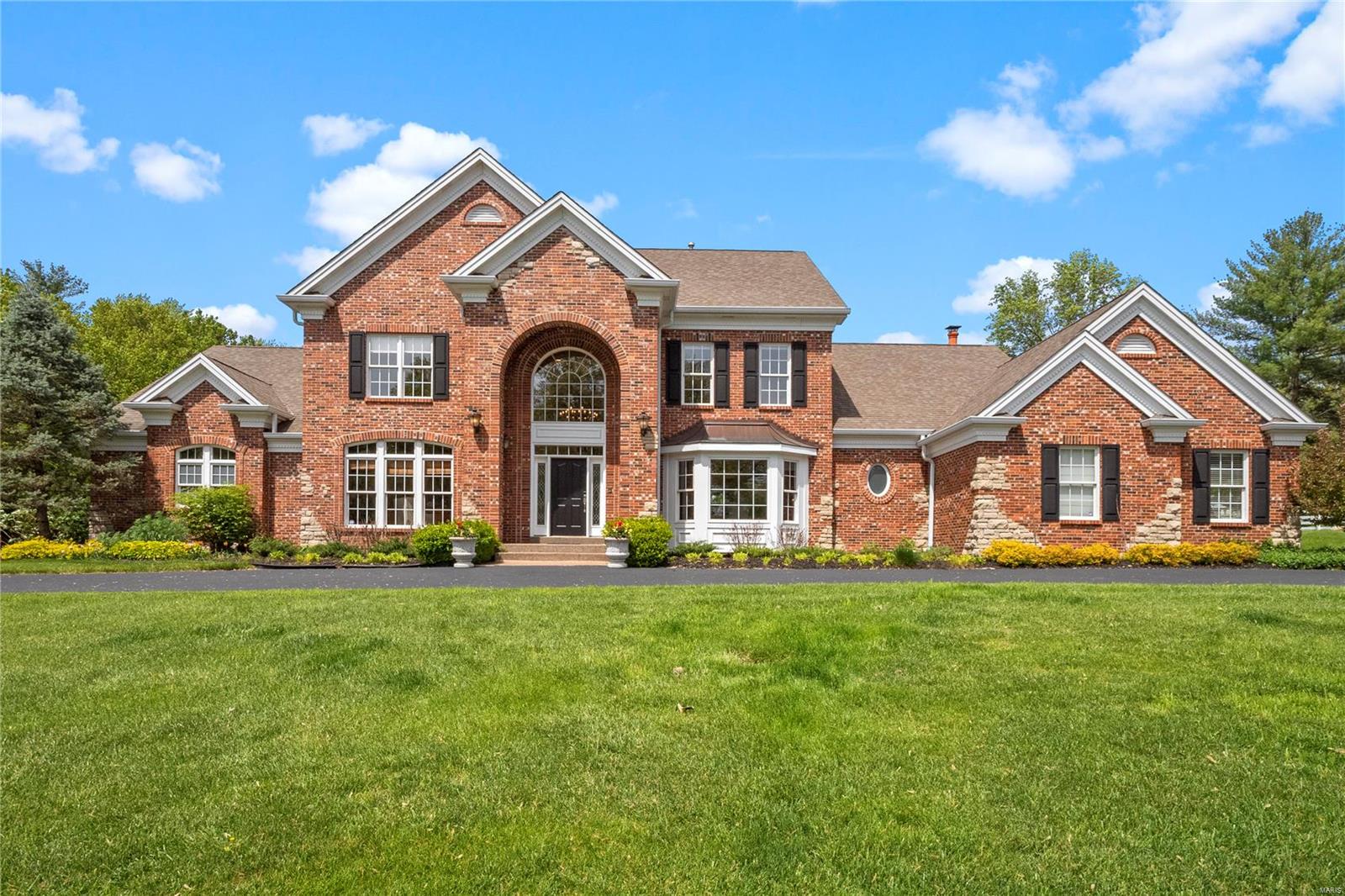 Architecturally significant Frontenac luxury home on 1 acre built by Robert Berkley & Sons Development in 2005 with cosmetic updates in 2021. Over 6,000 sq ft of living space with main floor master and magnificent Pebble Tec pool & spa. Well-appointed kitchen with center island, marble tile backsplash, custom 42” cabinets, new smart refrigerator, Viking stove, and large walk-in pantry. Master bedroom with tray ceiling, two spacious walk-in closets, and a “secret” door to the wood-paneled office. Spa-like master bath includes steam shower, heated floor, and dual vanities. Dining room features a 1,200 bottle wine room.  The second floor features three en-suite bedrooms and a spacious family room with new carpeting throughout. The lower level offers a 91” theater screen with surround sound and 10’ ceilings. Three car heated side entry garage. Private and peaceful outdoor setting with 45’x18’ saltwater pool, screened-in porch, and professional landscaping.