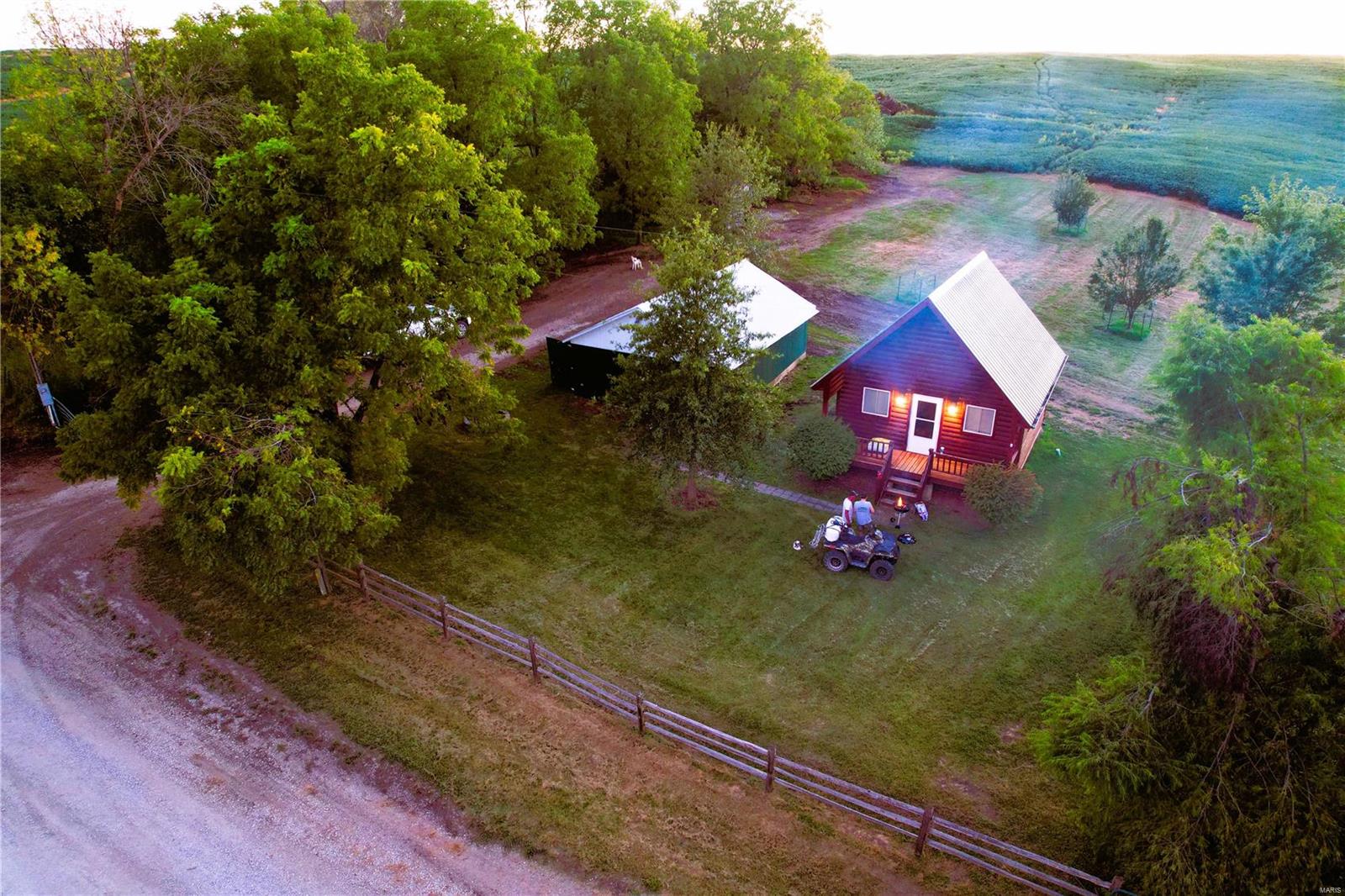 233.3 acres with incredible income and incredible hunting! This area is known for producing monster bucks and is extensively managed by all neighboring properties. 193 acres currently cash rented paying $40,000 per year. 2 stocked ponds on site, one over 2 acres in size. Small cabin near entrance, sleeps 6, and has all the amenities! (Even high-speed internet!) Neighboring shed has wood stove and AC, giving it endless opportunities for the next owner. Property also is home to a 30x40 Morton building with water, electric, and 8ftx40ft lean to, perfect for storing all your toys & equipment. Hunting lease income $10,250/year.