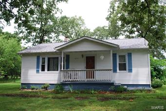 This charming cottage has 2 bedrooms and 1 bath. It sets on a paved road not far from Salem. The home has a newer roof, HVAC, windows and siding. There are beautiful laminate floors in the kitchen and both bedrooms, a fireplace in the spacious living room, and a partial storm cellar. The 3.5 acres has a well, septic, propane and several outbuildings. Bring your horse and chickens!