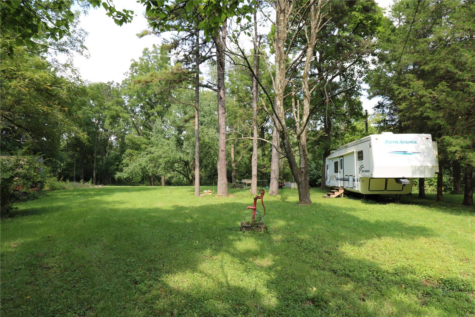 RIVERFRONT LOT w/ CAMPER NOW AVAILABLE!!  Looking for a spot on the Bourbeous River, well here it is! Grab this 1 +/- acre river lot with a camper (one-slide), electric, well, and septic. Enjoy this easy-to-get-to peaceful setting and all it has to offer.  There is gated access to help secure this and several other lots in this small riverfront community.  This is a great spot to hang out and have fun or to simply getaway to peace a quite. Set up your appointment today!