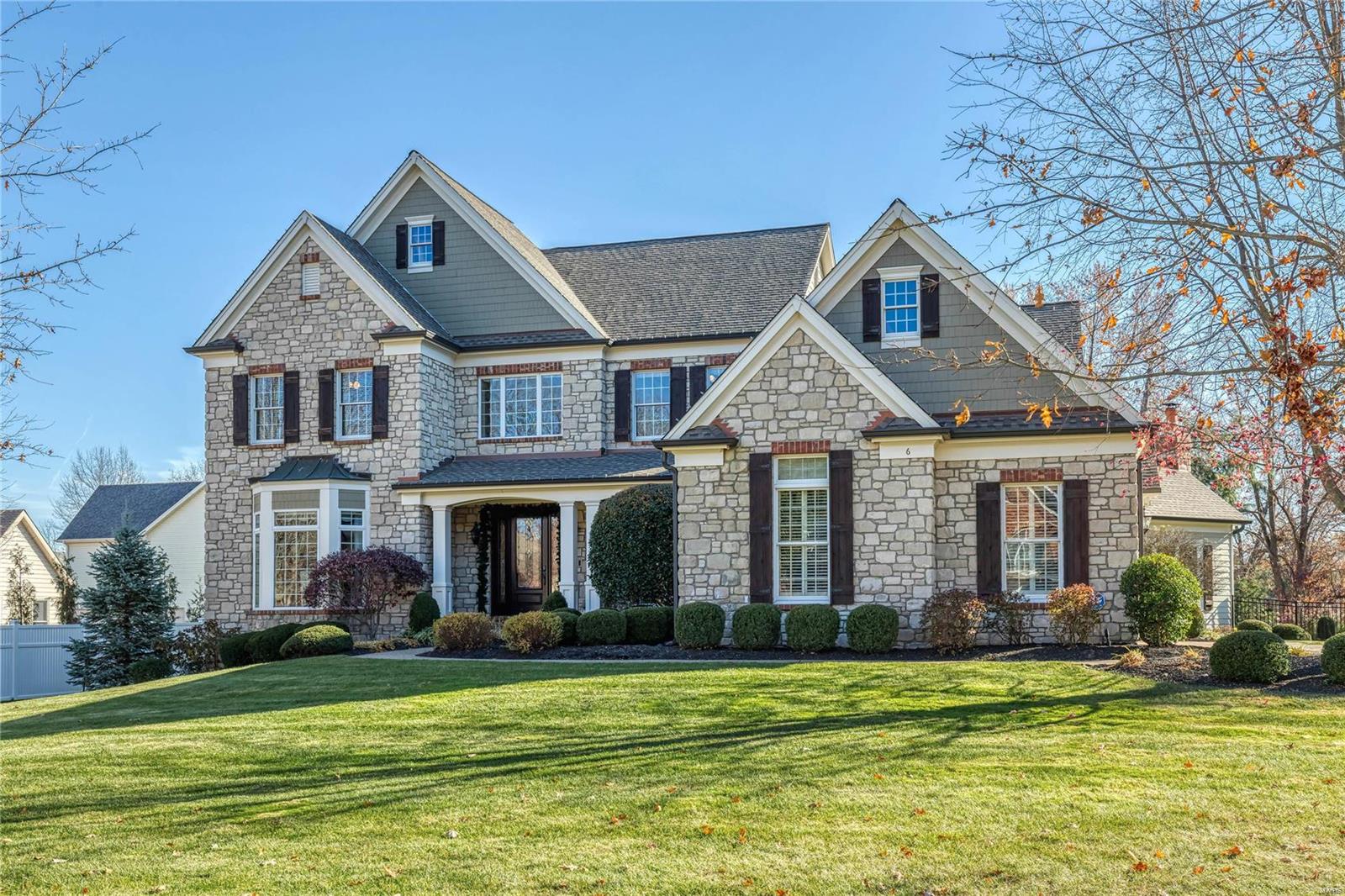 Spectacular stone-crafted 1.5 Sty in premier location! Impressive marble foyer leads to private study with French doors, elegant dining room and stunning great room with 12’ box beam ceiling, marble fireplace & bank of windows. Designer kitchen featuring granite countertops, glazed cherry cabinetry, butterfly center island & butler’s pantry adjoins light-filled breakfast room & hearth room with beamed cathedral ceiling & stone fireplace. Spacious master bedroom suite offers an appealing retreat with wide
bay window & beautifully appointed bath with jetted tub. Front & rear staircases access 3 additional bedrooms, 1 with ensuite bath & 2 with Jack n’ Jill bath, & bonus room with 3rd fireplace. Lower Level entertainment space includes recreation room with wet bar, game room, workout room, wine cellar & full bath. French doors open to outdoor living area with resort style pool surrounded by landscaped gardens plus stamped concrete patio w/pergola, grilling station & full-height fireplace Additional Rooms: Wine Cellar