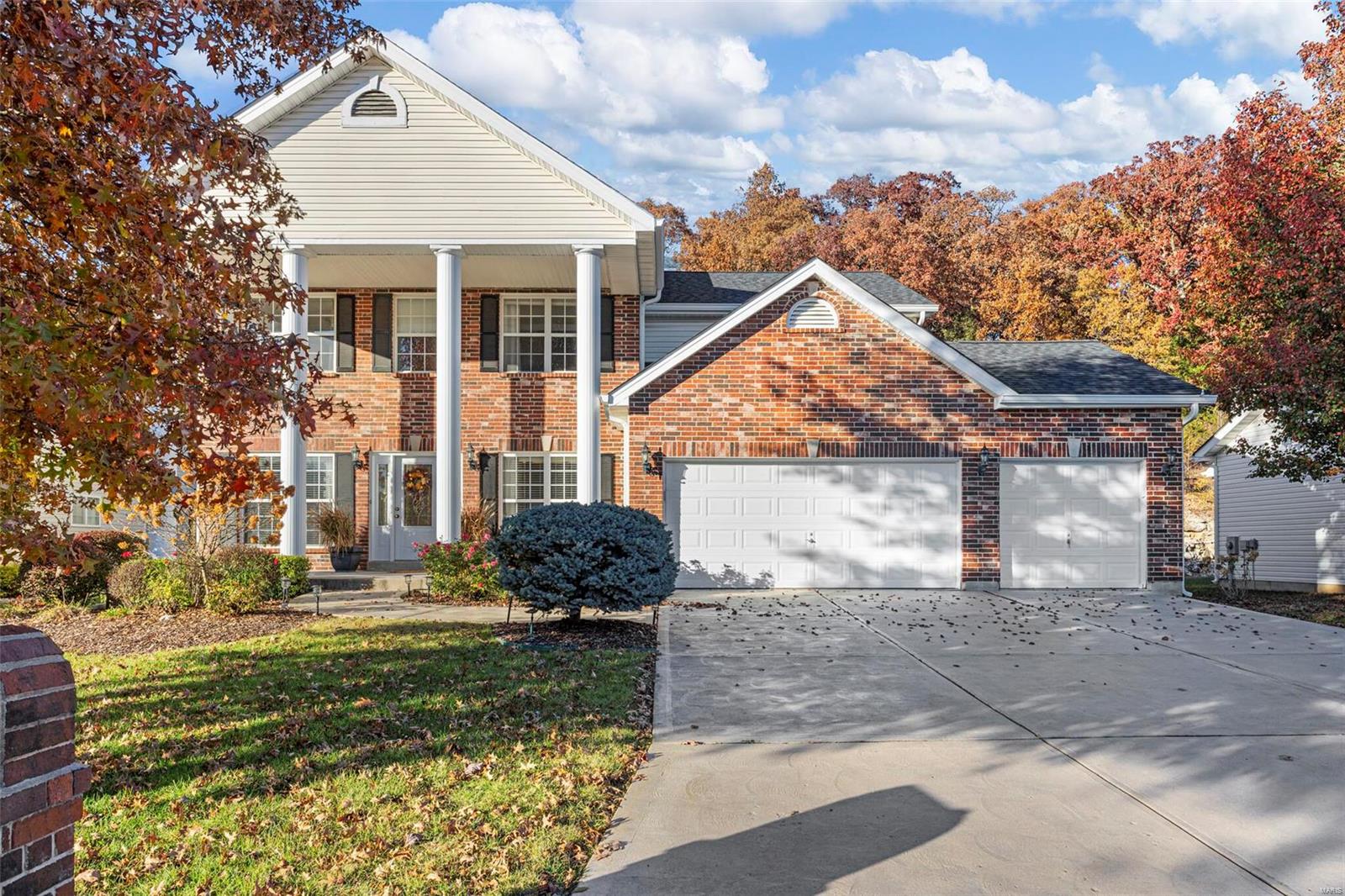 WELCOME HOME to this Beautiful 4BR 2.5BTH 2sty w/3046SF. This home has picturesque curb appeal w/brick front, stately columns, new roof, lush landscaping w/irrigation sys & insulated 3 car garage. Walking in the entry foyer w/gleaming HW floors you'll notice the living rm & elegant dining rm w/coffered ceiling. The family rm features a gas FP flanked by built-in bookcases & LG bay window. The bright & open kitchen offers custom cabinetry, center island w/bkft bar, tile backsplash, pantry, workstation & bkft rm w/slider to the patio looking out to the beautiful lvl backyard w/natural rock wall & wooded back property line. The upper lvl features the luxurious master suite w/walk in closet & deluxe full BTH w/dbl sink vanity, soaking tub & shower. 3 add'l BR & full BTH complete the upper lvl. The clean LL w/rough in for BTH & extended foundation is just waiting for your custom finish for added living space. The subdivision includes two beautiful lakes & is close to Dames Park. A MUST SEE!