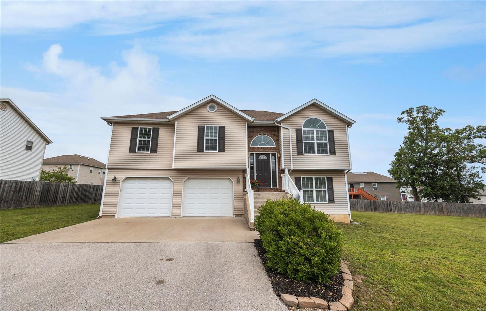 STUNNING 4 bedroom, 2.5 bathroom home in the highly desired Taylor Hills Subdivision! This home offers a spacious living room with vaulted ceilings and an open floor plan to the dining room and kitchen. The kitchen features beautiful custom cabinetry, BRAND NEW stainless steel appliances and a breakfast bar. In the dining room are the sliding glass doors that lead to the deck with stairs going down to the large backyard. The master suite includes vaulted ceilings, a double sink vanity, a large walk in closet and a separate shower and tub. There are 2 additional spacious bedrooms and a full guest bathroom on the main floor. The lower level offers a walk out door to the backyard, access to the 2 car garage, the laundry room with extra cabinet space, a family room, guest bedroom and a partially finished bathroom. All carpeting in the home is BRAND NEW! Don’t miss out on your chance to own this wonderful home! Call today to schedule your private showing!