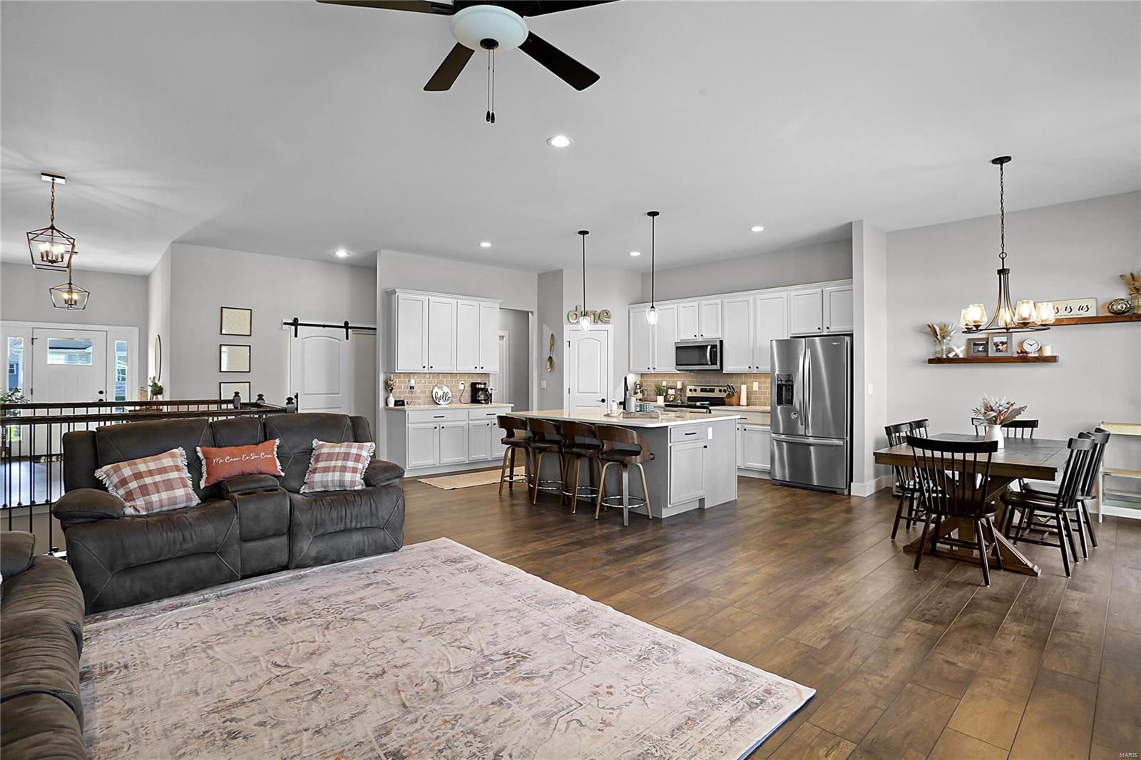 Why wait to build when you can have a NEW HOUSE NOW?! Gorgeous, newly built home with lots of custom upgrades, BEAUTIFUL finishes & tasteful colors.  Open Floorplan boasting 2,100 sq. ft. on the main level with 9 & 10 ft. ceilings. DREAM KITCHEN vibes with Granite countertops, tile back splash, stainless-steel appliances, HUGE kitchen island, 42" kitchen cabinets with crown molding & underneath cabinet LED lighting.  Other details include premium moldings, added can lighting and gas fireplace.  Stunning 4th bedroom, or could use as office/den or playroom with fabulous sliding barn door. Main Floor Master suite with gentleman's height vanity & luxurious, tiled walk-in shower.  
Convenient Main floor laundry.  Over-sized, 3-car garage with insulated, carriage-style garage doors.  Relax and BBQ on the large backyard patio. Plenty of space to grow with the unfinished basement with egress window & roughed-in bath.  Excellent location in a fun neighborhood! COOL: 14 SEER+