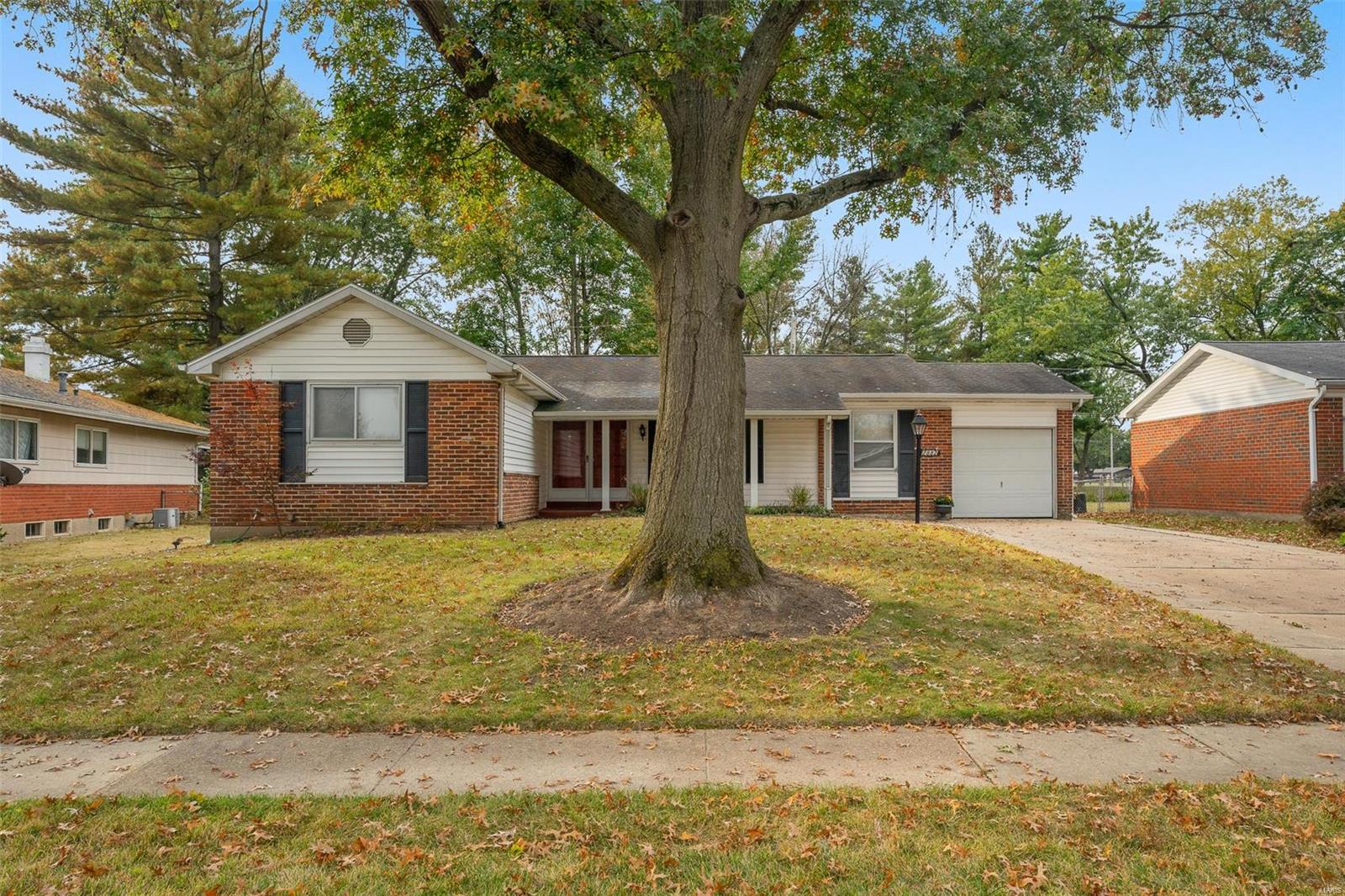 Awesome Location! Extraordinary Value! This spacious brick/vinyl ranch with superb curb appeal and amazing space that you really have to see to believe! Home features desirable 4 bedrooms and 2 baths on main floor, fresh paint, carpet and hardwood flooring, large living/dining room.  Fabulous kitchen offers updated custom cabinetry, center island and stainless steel appliances. Finished basement has a large entertainment room, lots of storage and a half bath.  One car attached garage with extra wide driveway. Low maintenance exterior,  large level fenced in yard with over sized covered patio with outdoor ceiling fans. Wonderful sought after Wedgwood neighborhood.  It is quiet and peaceful with a park just around the corner.  Neighbors greet you and are so kind. Conveniently located, close to major highway, recreation and shopping. The list just goes on and on. What an irresistible value!