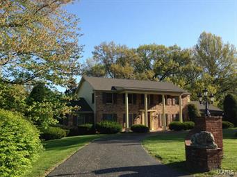 Wonderful opportunity to renovate this gracious Frontenac home into a showplace! The floor plan is flexible with large second floor  Master-Suite with nice bath and large closets, and well as a second large suite on the first floor. All the rooms are bright and spacious with hardwood floors throughout most of the home. The family room has nice bookshelves, lovely fireplace, bay window, wet bar and French doors to patio.  There is  also an opening to the living room from the family room .  The lower level has lots of possibilities with over 1600 square feet of finished space divided into three areas and walks out to gorgeous one acre lot!  
 Make this home your own and live on a lovely tranquil lane in Frontenac!