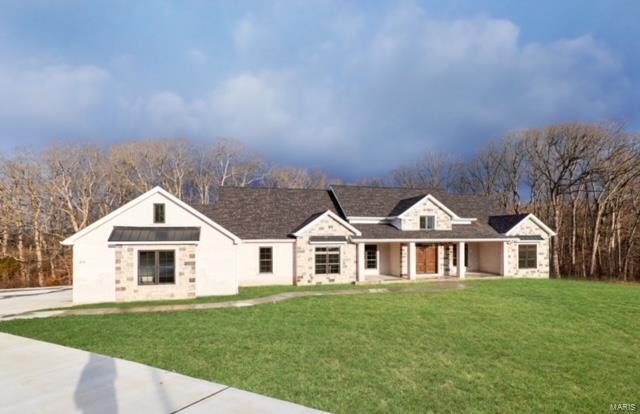 This beautiful Kohler Development home was built with you in mind.  This open concept floor plan is a show stopper with plenty of natural light.  A gorgeous 14' entryway greets you when you walk in the prestigious front door.  Vaulted great room & master bedroom ceilings, hardwood floors, custom cabinetry, and Andersen windows makes this the home the one for you.  Upon entering the great room, you are greeted with a lovely gas fireplace to your right, and a beautiful kitchen to your left. Get ready to impress your guests with your chef's delight kitchen featuring a 36" gas cook top, 2 dishwashers, range hood, wall oven, built-in microwave, tile backsplash, awesome island with booth and kitchen table.  There is a huge walk-in pantry with melamine shelving, spacious countertop, and space for an extra refrigerator.   In the great room, open the sliding door and step out onto an amazing screened in porch (16x24) with a perfect view of your secluded backyard. Additional Rooms: Mud Room