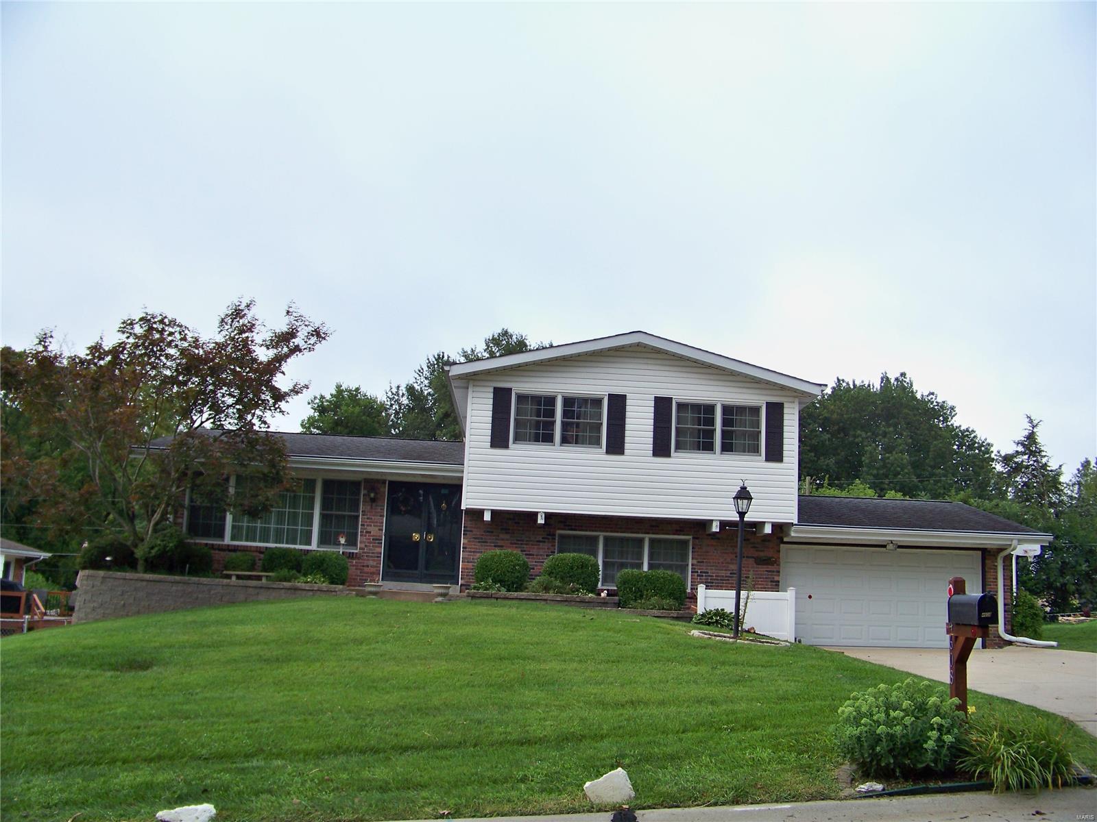SPACIOUS MULTI-LEVEL BRICK HOME WITH GREAT CURB APPEAL IN THE SOUGHT-AFTER BLUEBERRY HILL NEIGHBORHOOD IN LINDBERGH SCHOOL DISTRICT*THIS HOME HAS BEEN WELL-CARED FOR BY SAME OWNERS FOR OVER 40 YEARS BUT DOES NEED UPDATING*THERE ARE 3 BEDRMS/3BATHS, LIVING RM, SEPARATE DINING RM & LARGE FAMILY RM ALONG W/OFFICE OR WORK-OUT RM IN LOWER LEVEL*KITCHEN HAS CERAMIC TILE FLRING, A BREAKFAST BAR, INCLUDES  ALL APPLIANCES & BOASTS A WALK-OUT TO A TWO-TIERED DECK OVERLOOKING BEAUTIFULLY TREED LEVEL FENCED YARD JUST UNDER 1/4 ACRE*THE MASTER STE HAS AN UPDATED FULL BATH WITH NEW CERAMIC WALK-IN SHOWER*A FEW STEPS DOWN IS THE FAMILY RM W/WALK-OUT TO THE PATIO, HALF BATH, LOTS OF STORAGE & OFFICE/BONUS RM*THERE IS  2-CAR ATTACHED GARAGE THAT COMPLETES THE PACKAGE*GREAT LOCATION WITH EASY ACCESS TO HWYS 55 & 270!