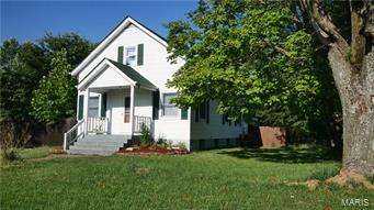 COME OUT TO SEE THIS BEAUTIFUL, TRADITIONAL 1.5 STORY HOME IN VILLA RIDGE! Great family setting. A very rare find w/ a .84ac lot & a fully fenced rear yard. You will love the large deck overlooking a perfectly flat yard setting up nicely for the outdoor entertainer in you. The spacious master bedroom features lots of charm w/ a bead board accent wall, loads of natural light shining through the newer windows, built-in bookcases & unique storage nooks along w/ his & hers closets & unique wood frame windows. A full bath & 2nd lg bed complete the upper .5 story. A very spacious living room provides a great place for a family to kick back after a long Spring day of play in the yard with enough room for family gatherings. This home boasts a very special kitchen w/ plenty of cabinets, a cooktop, built-in double ovens, a refrigerator nook, all with space savings in mind. Awesome glass interior doors & a main floor laundry/utility room are extras. Absolute Must See!