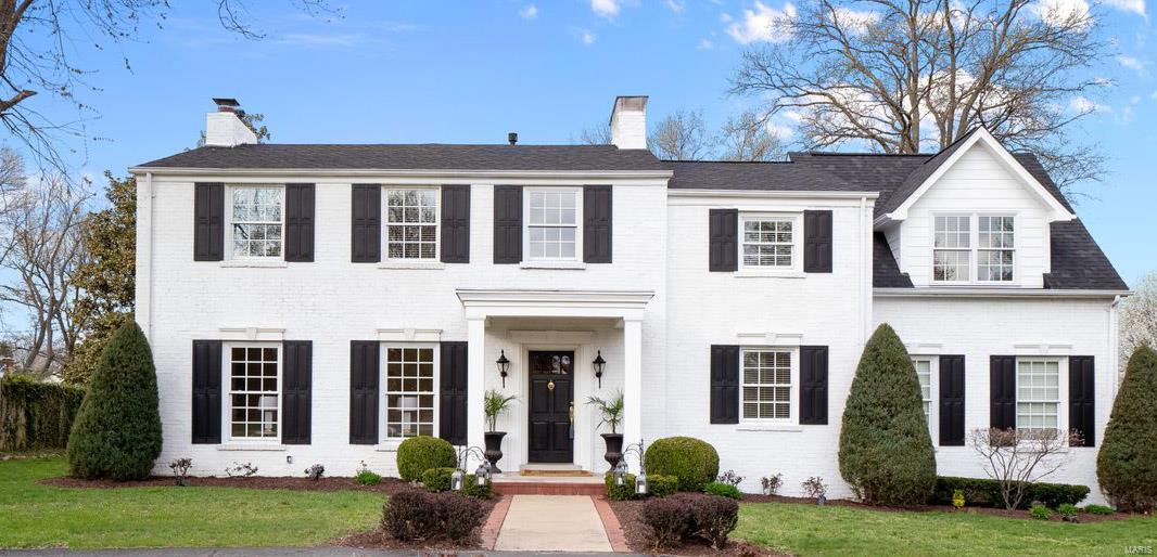 This home is the definition of classic and timeless in cherished Ladue. Entire interior is freshly painted and crafted to perfection. The 2 story entry foyer welcomes you into a bright LR with ample natural light and a stunning FP. Custom built-ins and rich hardwood floors flank the entire home. Elegant DR flows into a spacious FR with additional FP and walk-out to private patio. Wonderfully updated kitchen equipped with stainless steel appliances, granite counter tops, custom cabinetry and 2 wine coolers. Handsome private office off the back hall.  Upper level includes an Owner's Suite wing with amazing natural light and large walk-in closet. Private bath features double vanities, whirlpool tub and beautiful walk-in shower. Three additional BR's and 2 full baths on upper level with expansive closet space. Large 2nd floor laundry. Huge backyard and patio is perfect for entertaining your favorite people and room for a pool. It's move in ready and you'll love calling it home.