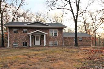 Beautifully remodeled split level home sitting on 1.14 acres just right outside Poplar Bluff city limits.The main level of this home features a custom kitchen with stainless appliances, slate type backsplash. Large open living area with deck off dining room that overlooks a park like back yard that is fenced. Main bathroom has double sink, upgraded tile and jet tub shower unit. Downstairs is large living area with rock fireplace, kitchenette, master suite with jet tub and multi jet shower unit. 2 car garage