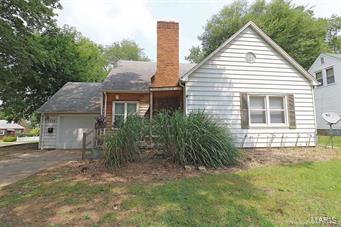 4 bedrooms, 2.5 bath 1.5 story on spacious corner lot.  Lots of hardwood floors, and bathroom on every level, plus fenced yard.  The one car garage is oversized and basement has walk-up access.  Original wood burning fireplace, formal dining room and adorable entry way.