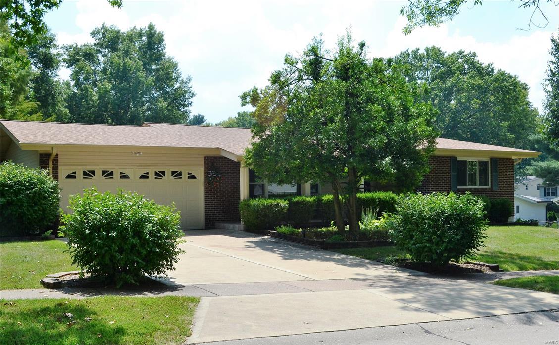 Spacious ranch home on a corner lot on a no-thru street. Huge covered front porch with porcelain tile floor, Aggregate patio in backyard, Nice landscaping, This home features 3 bedrooms, 3 full baths & a 2 car garage, Beautiful 3 Season room with a ceiling fan & light, 2 skylights and a ceramic tile floor. There is also an enclosed porch off of kitchen that leads to the aggregate patio. Entry foyer, Living room/dining room combination, updated kitchen with nice appliances, center island with shelves, huge pantry with shelves and additional 5 pull-out drawers & a ceramic tile floor, Main floor family room with sliding glass doors to the 3 Season room. 6 panel doors, crown molding & ceiling fans thru-out most of main level. Partly finished lower level with a rec/room, huge room for den or guest room, Addition room with shelves great for office, Laundry room, plus a walk-in closet, great for storage. This is a great home!