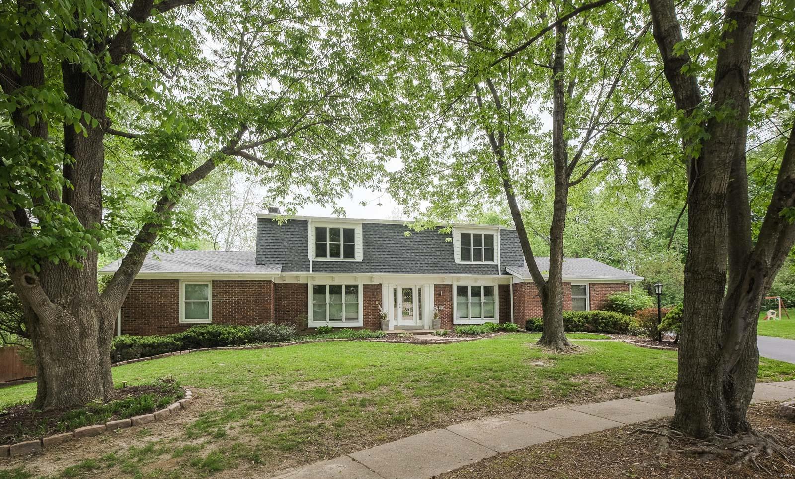 WELCOME to your own relaxing OUTDOOR PARADISE right here in Chesterfield!This 5 bedroom 3 full bath/2 half bath 1.5 story sits on a gorgeous 1 acre lot with in-ground pool!Updates galore!Designer interior boasts special accents from top to bottom!Updated kitchen includes Quartz countertops,custom back splash,center Island, 42" cabinets,Double oven and gas range. Separate dinning room. Great room has beamed ceilings and beautiful custom wood burning fireplace and door to upper deck.Main floor master suite complete with travertine tile soaking tub with 4 additional bedrooms upstairs. Walk out Lower level is finished with additional bath, recreation area, den/home office and media area . AMAZING yard  with extensive landscaping and pool area complete with darling "tiny house"!An abundance of Updated windows throughout make this home light,bright and extra special. Newer roof,gutter guards and siding.Home camera security system included. Irrigation system.Zoned heating and cooling!