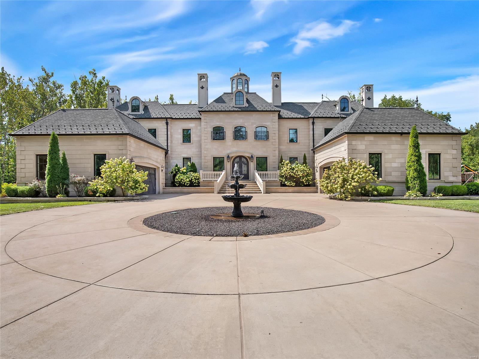 Have you ever seen a home this stunning? The exterior is elegant and impressive. This modern French Chateau is bold and luxurious everywhere you look. You will feel royal as you step through the front door with the duel sweeping staircases and rotunda tower. Huge kitchen & hearth room are perfect for entertaining large groups of family and friends. Step outside to your attached loggia a perfect spot to sip your morning coffee before work. 1st floor master suite with spa like bathroom and custom walk in closet. Upstairs bedroom suits with direct access to baths. 12ft walk-out basement feels like an entire home of itself with full kitchen, 500 bottle wine rack, top of the line movie room, gym, hidden TVs, and timeless finishes. Enjoy roaming on your 4+ acre lot and then cool off in your pool. His and hers garages, walk in pantry, mud room, butlers pantry, and planning office. Close to wine country, 100M dollar Augusta development coming, and just 15 minutes to Chesterfield Valley. Additional Rooms: Mud Room