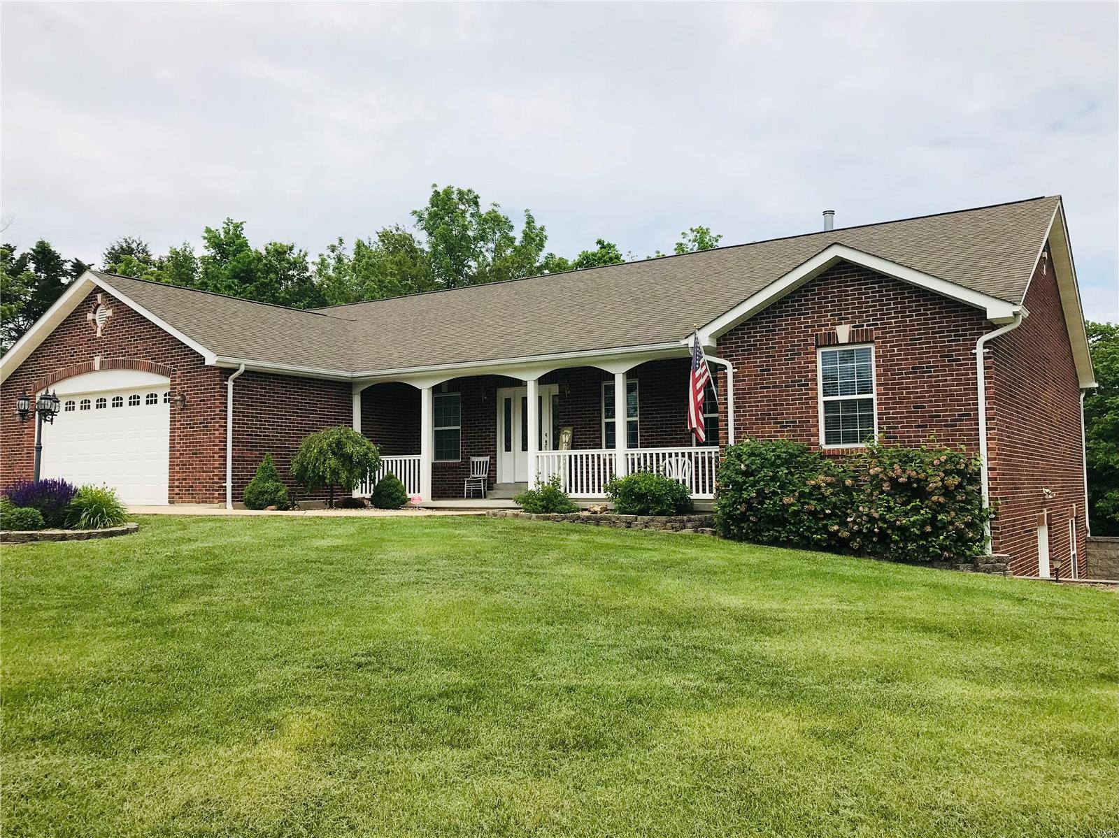 Don't miss out on an opportunity to own this immaculate all brick ranch home situated on 2.6 ac. Nice location just outside of New Haven & 20 minutes from Washington. Various choices of High Schools to choose from. Come walk into this welcoming great room w/a beautiful gas fireplace & vaulted ceilings throughout the great room, kitchen & dining room. Kitchen/Dining combo. Kitchen features custom oak cabinets, pantry, spacious counter tops & breakfast bar. Large main floor laundry. Master suite offers coffered ceiling, his & her closets. separate vanities, jet tub & separate shower & private stool area. 2 additional bedrooms w/carpet. Nice office room. Walk-out lower level is finished w/built-in entertainment center, family/sitting room, rec/wet bar area, 1/2 bath & massive storage room w/built-in shelves. Oversized 2 car garage. Fabulous level lot. Large driveway w/lots of parking space. Other amenities are concrete patio & cedar deck perfect for entertaining or just relaxing. Must see