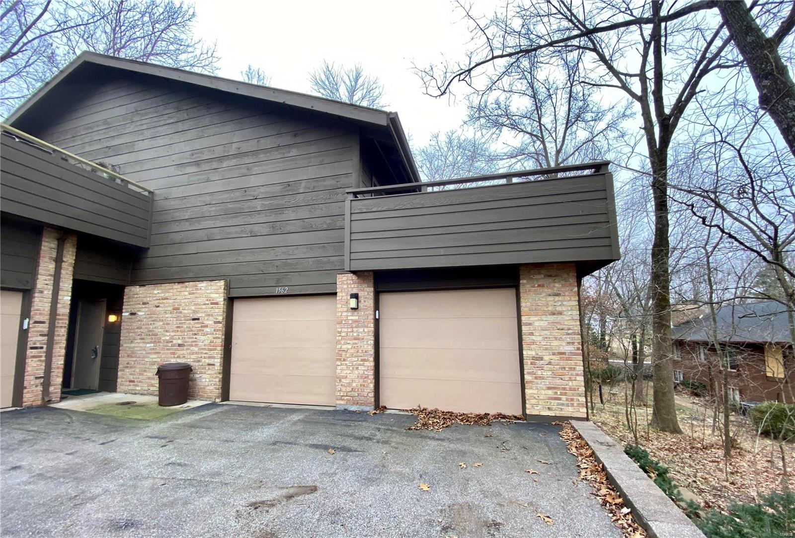 Incredible opportunity to grab this unique townhouse condo. Birnhamwoods complex is a wooded paradise, with trails and wildlife in a convenient mid county location. Main level has an open floor plan, newer wood floors in living room, dining room, updated contemporary kitchen and a tremendous deck that overlooks pool and tennis courts. Master bedroom (used to be 2 bedrooms) is an awesome space with an impressive closet. Master bath is in original condition. 2nd bedroom, and an original hall bath complete this level. The lower level: carpeted family room, brick fireplace. Lower windows have plantation blinds. There is a  lovely updated contemporary half bath and an office and mudroom area. There's newer HVAC and water heater. No seller's disclosure available. Unit needs finishing touches. See www.birnamwoodcondos.com for more neighborhood information. Contract requested is a Special Sales Contract. Unit to be sold "as is". Offers to be presented on 1/18. Make response time 1/19. Location: End Unit