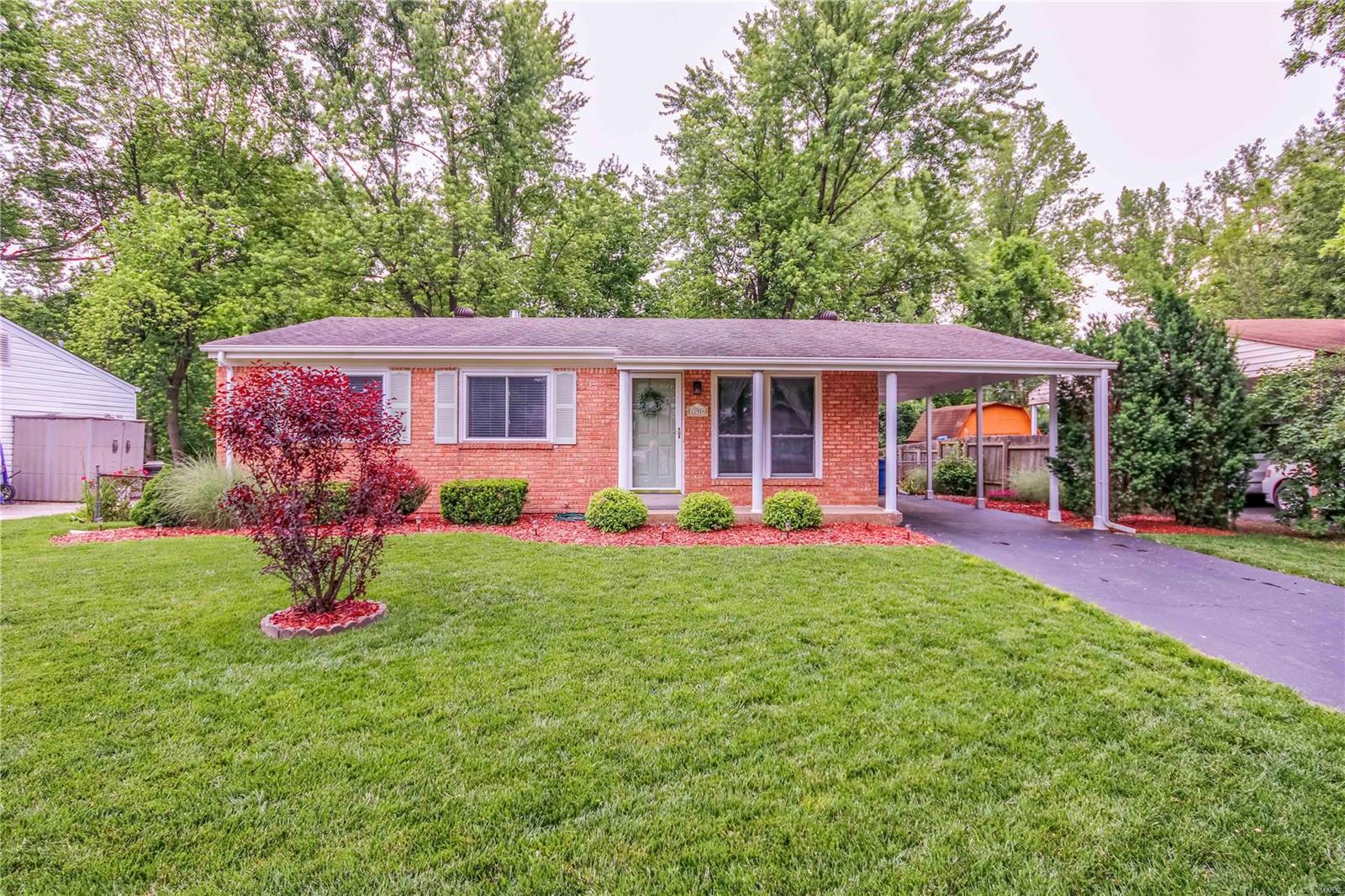 Impeccably well-maintained home showcases extreme pride-of-ownership... boasting 3 bedrms, 2 full baths, deep covered carport, 1,768 total sq ft incl wonderful finished basement, $30K+ in improvements & absolutely spectacular park-like lot backing to woods. Great curb appeal, brick front, upgraded architectural roof, updated A/C, low-maintenance vinyl siding, enclosed soffits/fascia, thermal windows, newer front & storm drs, inviting covered rear patio, 2nd brick patio, shed, level fenced lot w/manicured landscaping. Cheery home w/streams of natural light, absolutely gorgeous wood flrs, warm neutral paint, 6-panel drs, attic fan, 2" blinds, updated light fixtures & ceiling fan. Abundant white kitchen cabinets w/built-in pantry, granite counters, appliance updates, beautiful stone backsplash, incredible view of back yard! Nicely finished LL offers huge recreation rm w/handsome brick wall, office, carpet 2021, 2nd full bath & great storage. Great convenient location, Pattonville Schools.