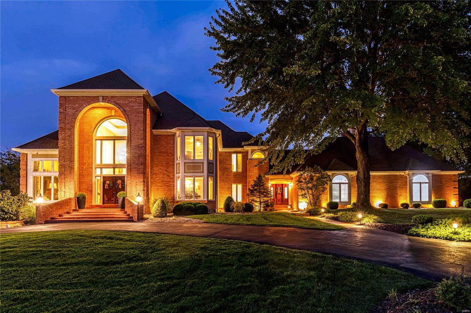 Stunning Alport-built 1.5 Sty in premier gated neighborhood. Expansive marble foyer highlighted by dramatic floating staircase leads to private study, beautifully appointed dining room & coffered great room with soaring windows, brick fireplace flanked by built-in bookcases & wet bar. Downsview-design kitchen with 42” maple cabinetry, granite countertops, KitchenAid appliances, 6’ center island & butler’s pantry adjoins glassed-in breakfast room & vaulted gathering room. Primary bedroom suite with tray ceiling, wide bay window & luxury bath with oversized jetted tub offers an appealing retreat. The 2nd floor extends the living quarters with 3 additional bedrooms, 1 with ensuite bath & 2 with Jack n’ Jill bath. Walk-out Lower Level includes recreation room with see-through marble fireplace & wet bar, game room, media room & family room with fireplace plus workout room, sauna & full bath. Situated on a .9-acre lot with pool with waterfall wall, deck & patio with full-height fireplace.
