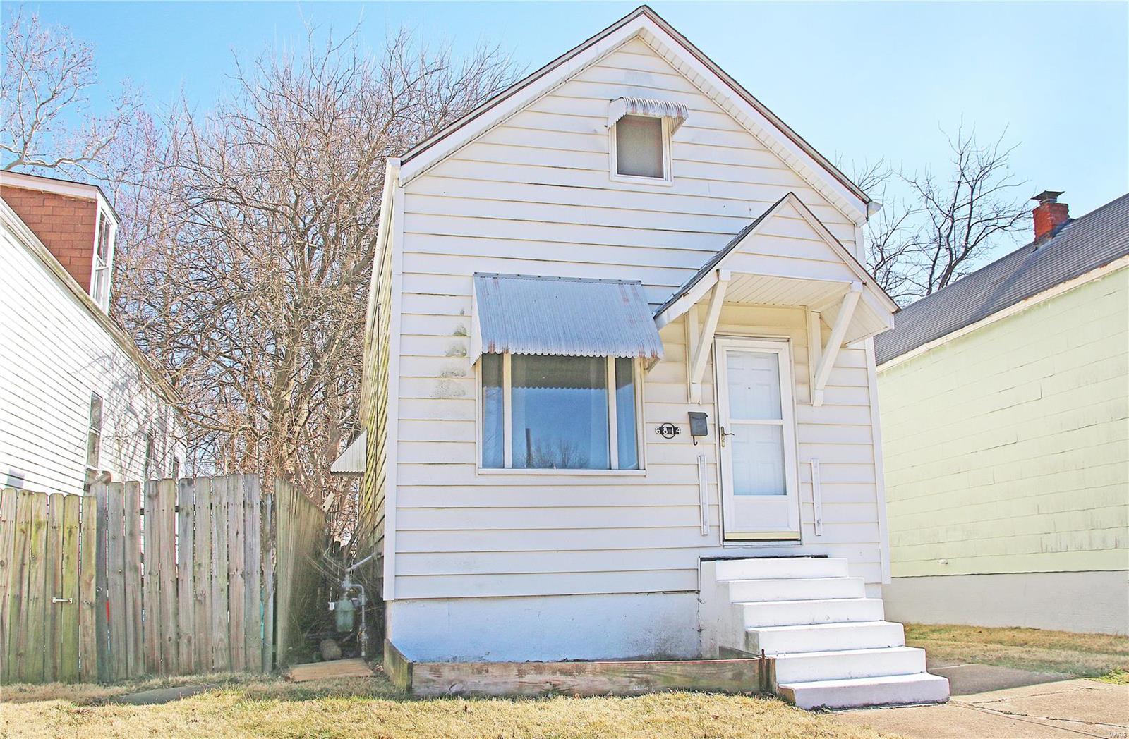 Welcome to this cozy home on a tucked away street waiting for it's new owner.  This 1 bedroom, shotgun style bungalow has a large bonus room upstairs that could be converted to additional bedrooms or living space.   Gather around your firepit in this spacious backyard which is also accessible from the alley.  Enjoy living near restaurants, shopping, parks, highways and public transportation.  Home is being sold as is, seller is not providing any inspections.  Buyer may obtain inspections for their own information.  Make your appointment today!