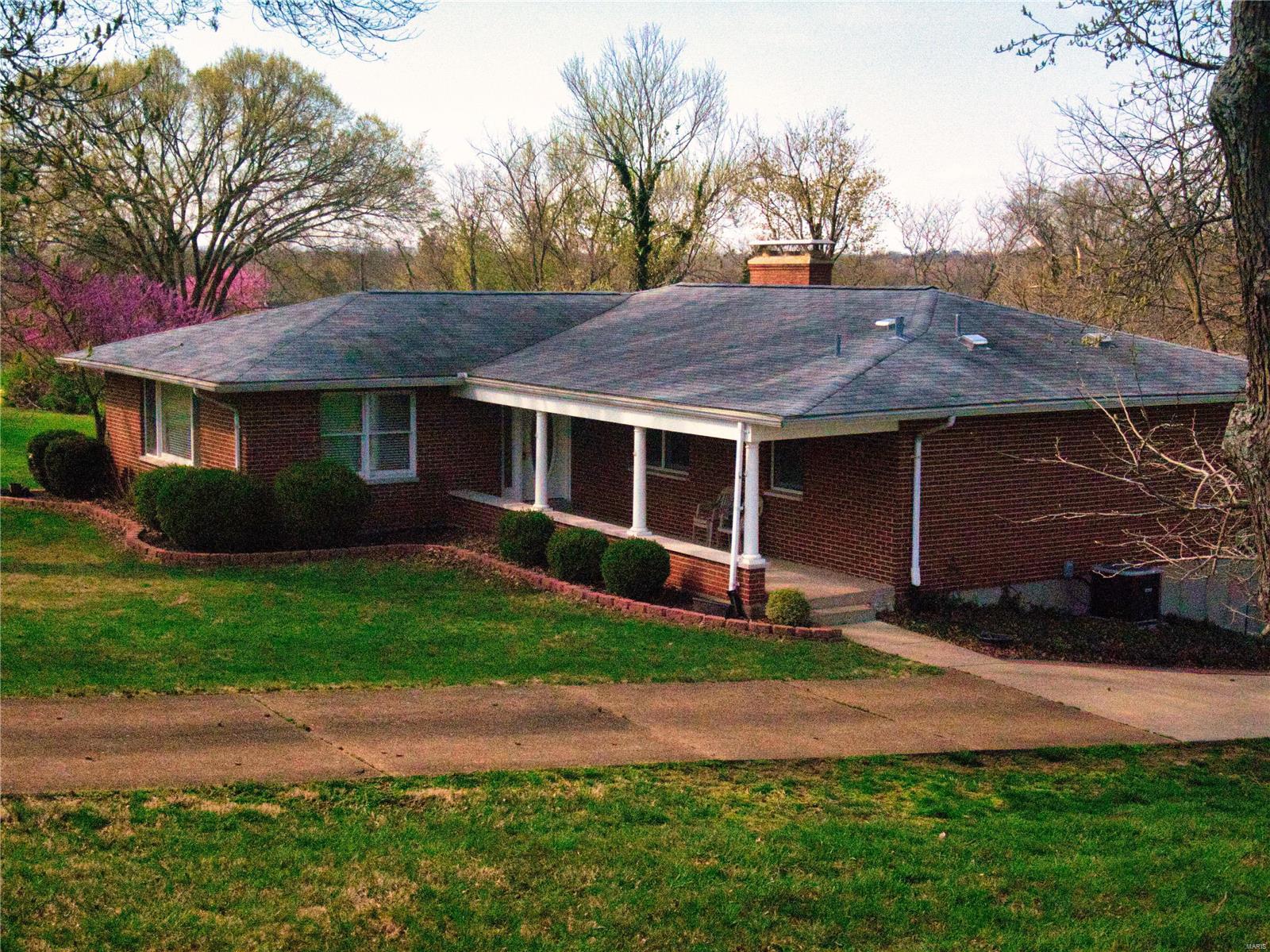 NEW $$$ Enjoy all the perks of being next to "world famous" Paul A. Schroeder/Manchester City Park without any of the upkeep :) Everything in the park is at your disposal. Relax & take pleasure in watching the seasons change from this ideal location. 1912 sq. foot home sits on just over a THIRD of an Acre in a prime West County location & Renowned Parkway School District.  Has a bit of a Retro feel to it & you can tell the owner loved their home--but it will need updating & neutralizing. Good floor plan & space. 3 bedrooms. 2 full baths on the main floor. Ample sized rooms & closets.  All Brick exterior with enclosed soffits, walk-out unfinished basement, excellent parking area plus a Very Over-sized garage. 2 fireplaces--one in the basement & one in the Family Room. Andersen Wood Windows make every room nice & bright. Large covered front porch beckons your guests. Small deck off Family Room provides EZ access the yard. Home is proximate to schools, shopping & highway access.