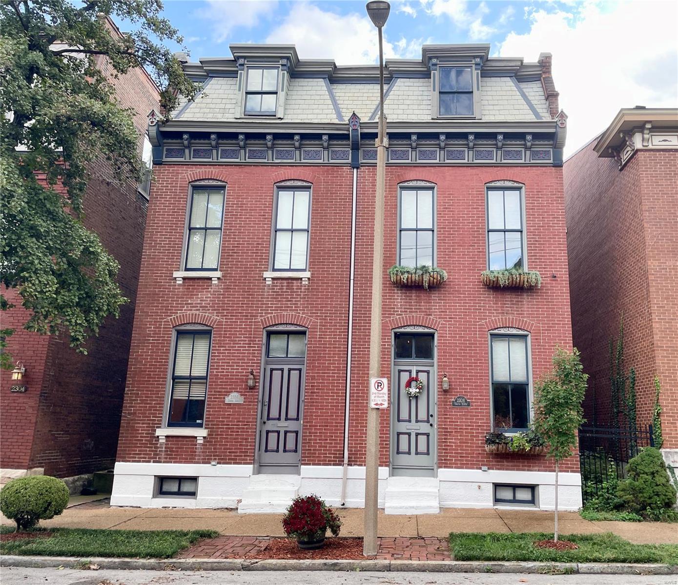 Welcome to Soulard living with this beautiful brick home. Spacious design starts with 12 ft ceilings and tall windows throughout. The main level features wood floors LR/DR and ½ bath. The charming updated kitchen has 42” cabinets and breakfast bar. Second floor has office/sm BD and laundry area. Well-appointed BD suite has luxury bath & walk-in closet. A second set of open stairs leads to another BD suite ! The large main area has built in bookcases, walk-in closet plus full BA that has a shower+sunken tub. Covered walkway off kitchen leads to private gated backyard ready for entertaining. Parking pad has 2 spaces. Neighborhood friendly location has small park on the corner, a community garden and take your golf cart to nearby restaurants like McGurks or the Soulard Market. Anheuser Busch, Ballpark Village and the Arch are just some of the sites you can visit. If you love city living, you’ll love this home.
This is a Duplicate Listing to Condo MLS #24061259.