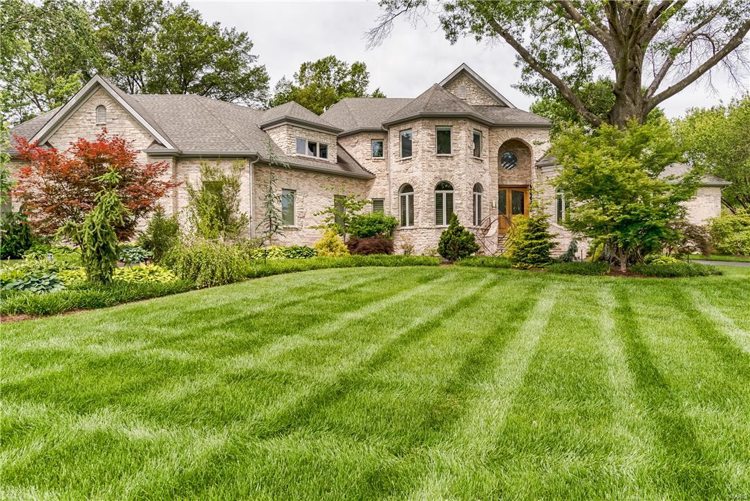 Contemporary masterpiece, custom-built by Jeffrey Homes, is a work of art. Clean lines, soaring ceilings, and the use of unique stone and materials. From the moment you walk through the custom French, leaded-glass doors you will be wowed. Host amazing dinner parties from your award-winning kitchen featuring top-of-the-line appliances, two custom center-islands, and a range hood covered in lustrous mosaic tiles which repeats in a unifying backsplash around the kitchen’s perimeter. A barreled-ceiling welcomes you to the luxurious master and opulent master bath. Additional living spaces on the main floor. UL with additional loft area and spacious bedrooms. LL offers a theater room, gaming area, and a bedroom suite perfect for those after-party guests. Incredible grounds with stunning pool complete with waterfall and slide, hot tub, fire pit, and recessed trampoline. Prime location in Ladue Schools and close to all major highways and shopping. Simply put, this home is best in class.