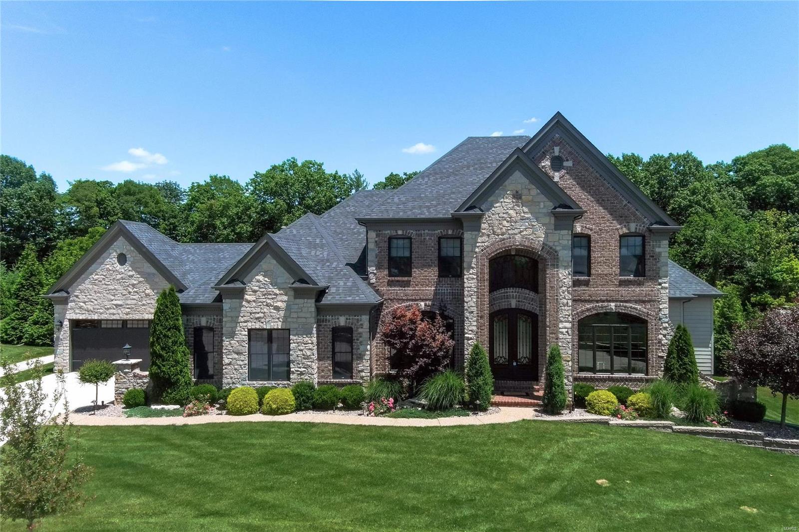 Meticulously maintained 6 bed, 4 1/2 bath, 4 car garage, 1.5 Sty in prestigious Arbors At Wilmas Farm.  Extensively upgraded custom finishes throughout home. Chef's kitchen w/custom cabinets (glass uppers, lighting), Cambria tops, 48" Wolf cooking, Sub-Zero refrigeration, oversized island, walk-in custom finished pantry, wine fridge & designer lighting! Master suite boast French doors to outdoor living, luxury bath w/jet tub, oversized shower, dual vanities, & his/hers outstanding separate walk-in custom closets. 10' main / LL ceilings, atrium windows, formal dining, upgraded mill / trim work, 8' doors, crown, wainscoting, built-ins. Finished LL has full bath, wet bar, media room, 6th bedrm & walk in wine cellar. Professional landscape, Resort inspired exterior with expansive custom covered outdoor living, cooking, fireplace & fire features, Pebble Tec pool w/ hot tub! Style exudes in and out w/ custom designer finishes & it shows. Great for family life & entertaining. See Virtual Tour Additional Rooms: Wine Cellar