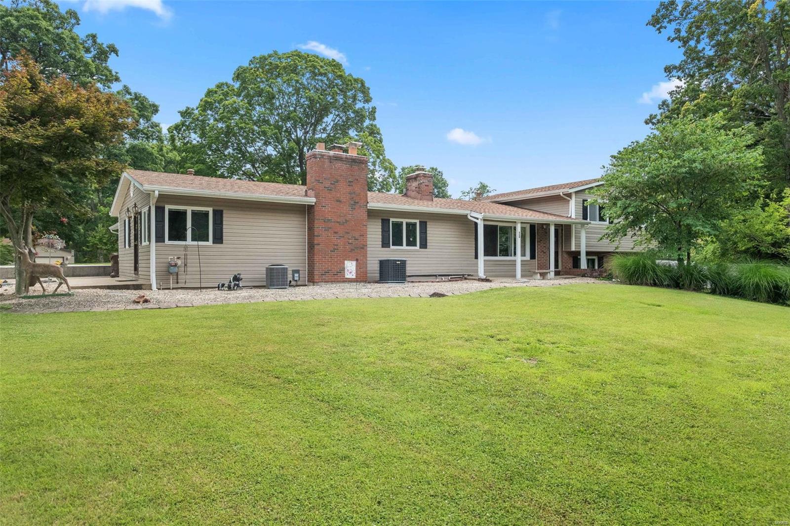 1.9 Acres in the heart of Lake St Louis!  You're going to love this park like setting nestled in a quiet neighborhood seconds from Lake Forest Country Club.  This 4 bedroom 2 bath multilevel home has been meticulously maintained, but leaves room for you to make it your own.  It features a 3 car garage, tons of parking and a large oversized shed for all your toys.