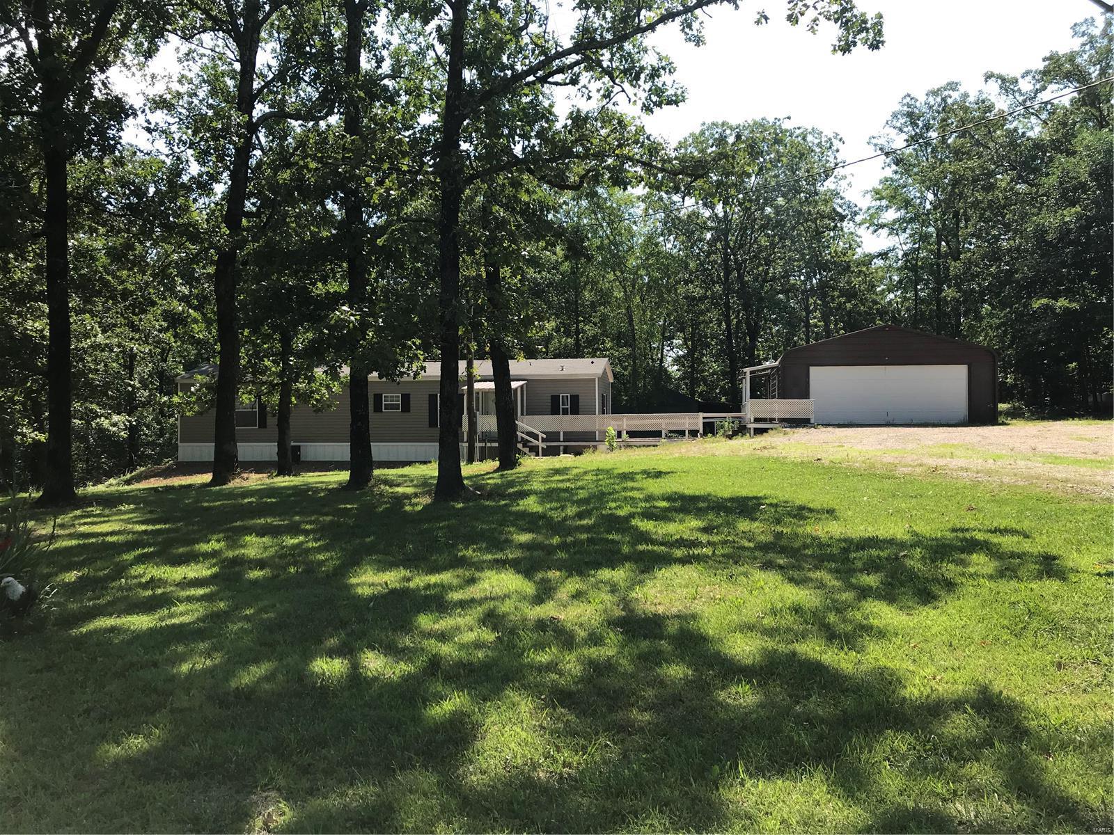 If you are looking for that place to get away from the hustle and bustle of this crazy world, you need to check this out. Close to Wappapello lake is this newer manufactured home sitting on almost six acres. This very well maintained two bed, two full bath home is clean and neat. All electric with all appliances staying with the property. There is a detached oversized garage with a possible guest room complete with bathroom inside. An equipment shed in the back yard for storage and a 35 x 40 pole barn for your RV and Boat storage. The mobile home is open and inviting, situated on one of two lots with a very nice yard shaded by mature oaks. The additional lot gives you the privacy that you want for your weekend get-away or make this your everyday home and enjoy the tranquility of being off the beaten path. The property has surveillance cameras already installed for peace of mind while you are away. Come take a look and make this property your new home or home away from home.