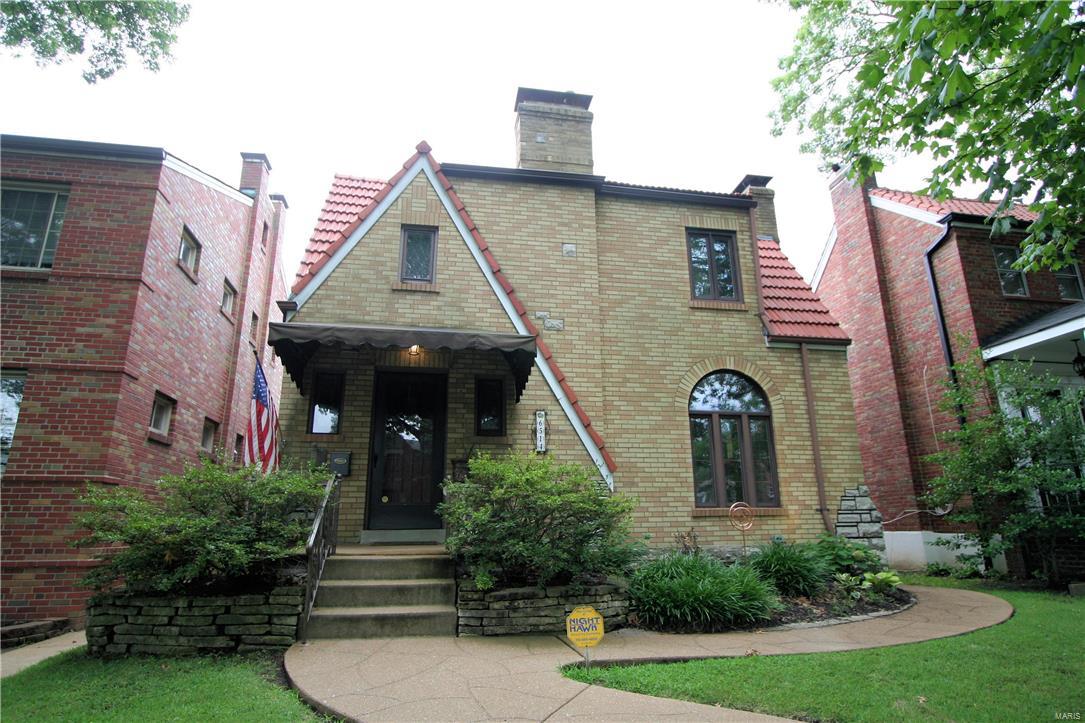 Stunning 2 story brick home in the St. Louis Hills neighborhood has been meticulously maintained, with all the charm and elegance one would expect. This beautiful home opens to a spacious, sun-filled living room that looks to an impressive formal dining room. The dazzling, eat-in chef's kitchen will be the highlight of holiday gatherings, with granite counter tops, center island with breakfast bar, and high-end stainless steel appliances. Upstairs, the large master bedroom includes dual closets and extra living space. Two additional bedrooms and an updated full bathroom complete the floor. The finished, walk-out lower level is fantastic, with a rec area featuring custom barn wood bar, significant living space, and ample built-in storage. Outdoors, the fenced, level backyard is perfect for outdoor entertaining, with a sun room and patio. A covered porch, two car garage, and beautiful landscaping only add to the curb appeal of this incredible home. Close to parks, restaurants, and more! Additional Rooms: Sun Room
