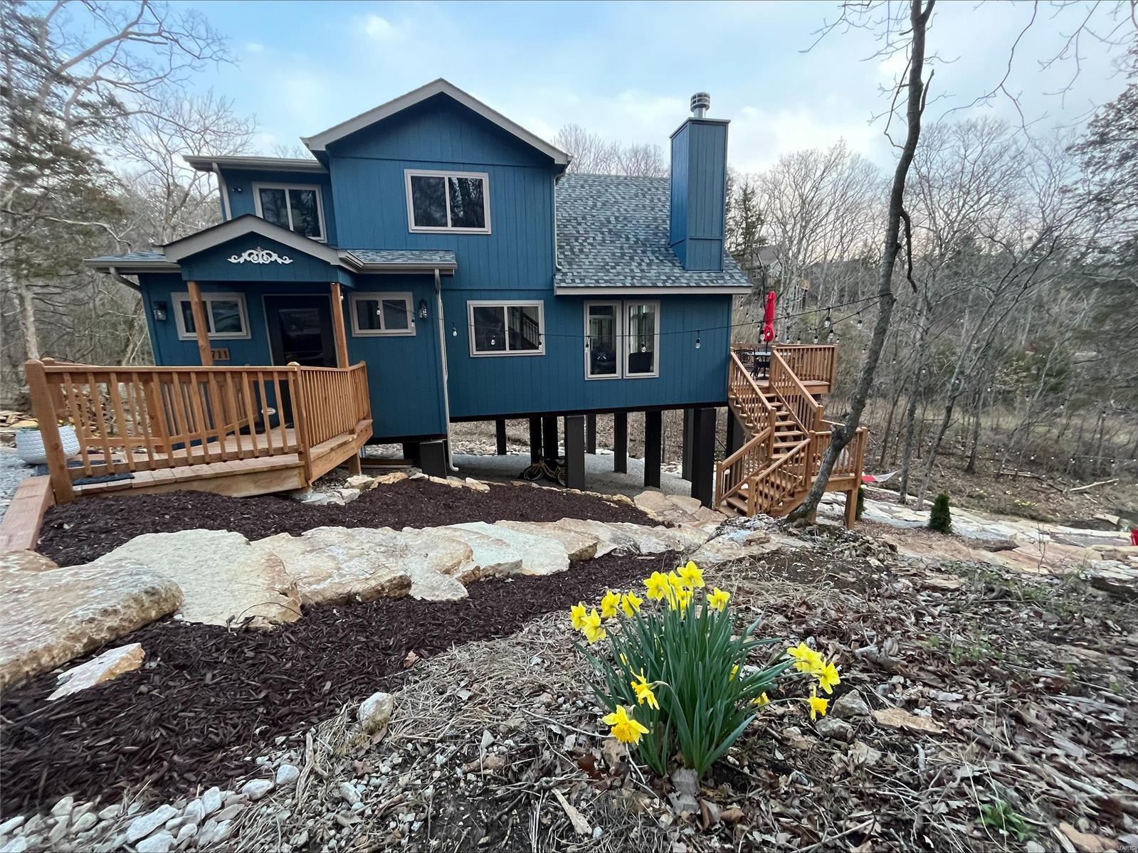 BRAND NEW chalet and furniture - make your summer dreams come true in this AMAZING chalet on Lake Frieden! This long lake has a big lake feel and is perfect for Paddleboarding and Kayaking and fishing! Hop on the trailhead steps outside the front door or make a big meal in the expanded tiled kitchen with island. This chalet lot has so much character, you need to see it to appreciate the extensive landscaping and limestone steps added to create a cozy atmosphere and bring you closer to nature. Inside the front door are cubbies for all your gear and a window seat custom made to take in the lake view with a book in hand. Screened porch offers views and the sounds of the wet weather creek and allows you to hunt for some pretty amazing fossils! Lots of upgrades and attention to detail in this property! Whether this is a family getaway, or you are using as an investment property rental, this chalet is ready for you this summer!