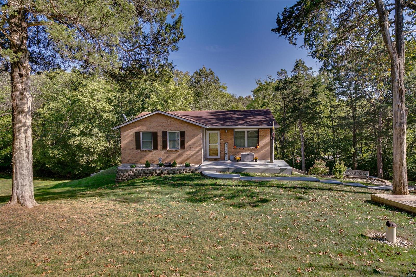 Charming ranch home with lots of character, recently updated kitchen and baths, master bedroom with 1/2 bath, large main floor bedrooms, possible third bedroom in the lower level or rec room, two car tuck under garage, stamped concrete leading to large front porch not to mention a spectacular lot that is a little over a 1/2 acre with an awesome view! Other updates include newer windows, doors, well pump, HVAC has an annual service plan and new 2020 water heater. SUPER LOCATION AND MOVE-IN READY! Don't wait call today!