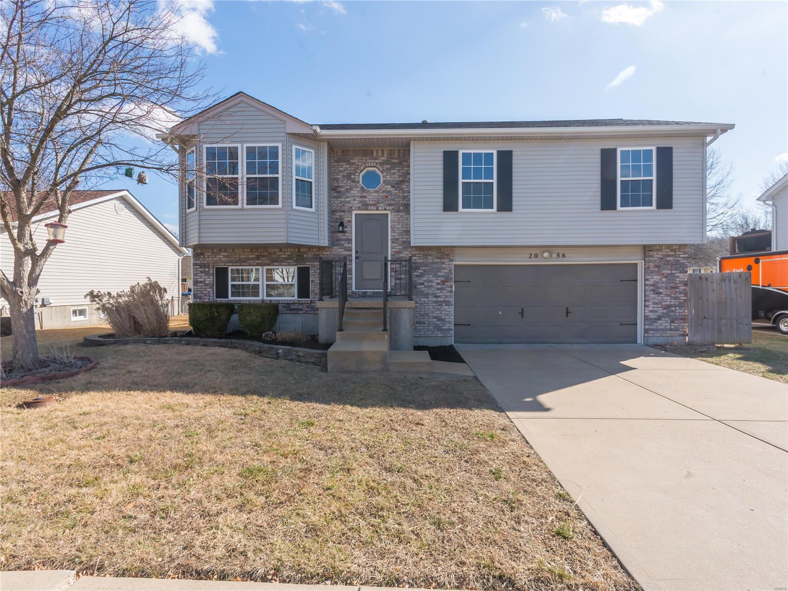 Newly remodeled home! This 4 bed/ 3 bath home has so much to offer. This home has been completely renovated on the inside. The home has great curb appeal with landscaping, new shutters, and handrail. There are new vinyl floors , cabinets, granite counter tops,, stainless appliances, light fixtures. Just outside of the breakfast room there is a large deck that leads to the Huge Patio and fenced Large Level Yard. There are 2 baths on the main level- w new vanities , flooring and lights. There is new carpet throughout the bedrooms. The Lower level is finished and can be a 4th bedroom with bath or rec area with bath. The Garage is oversized. You will love this home