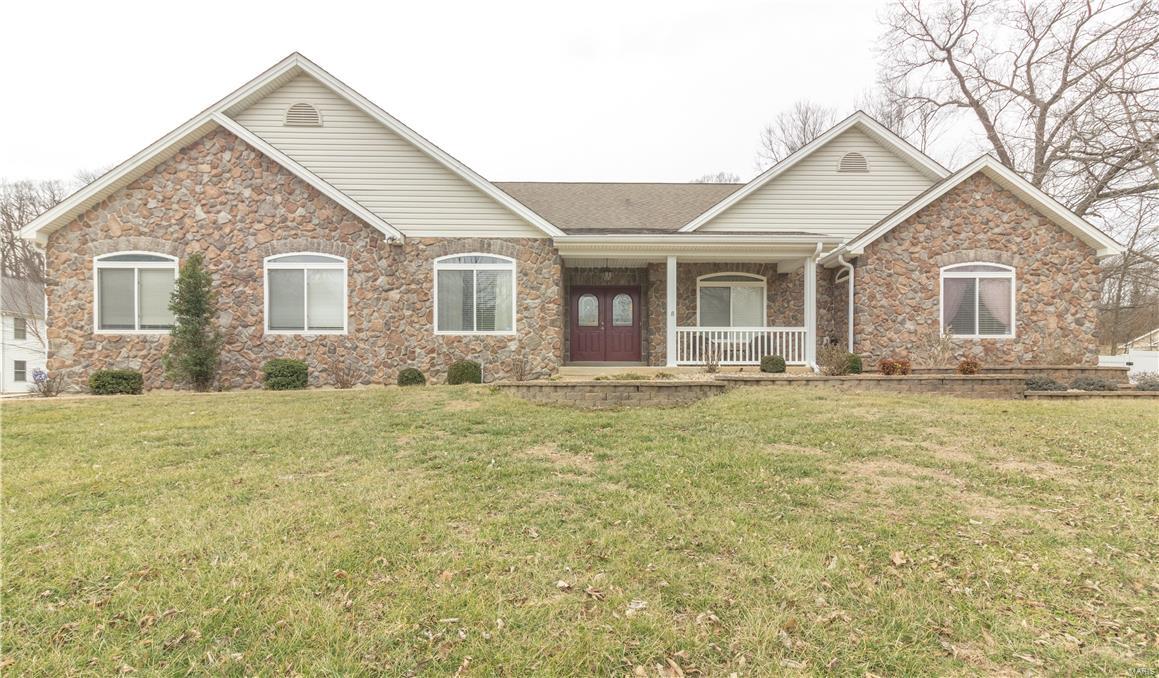 Large foyer that flows into amazing great room with hardwood floor, cathedral ceiling and floor to ceiling, stone fireplace. 15 x 15 breakfast room off of great room that connects to large, updated kitchen with custom cabinets, center island and stainless steel appliances. Walk in pantry, main floor laundry and half bath off of kitchen that walks out to oversized 3 car, side entry garage. Sliding door off of breakfast room walks out to enormous patio that has a covered area as well. Master Suite contains large walk in closet and updated bathroom with solid surface countertops, his and hers sink and separate tub and shower. Master bath also has it's own door to covered patio area. Bedroom 2 has private full bathroom and Bedroom 3 is across the hall next to another full bath.  Finished LL with Bedroom 4 and full bath with oversized shower and separate sinks that are perfect for out of town guests.  Enjoy the media room, large bar or rec room in LL as well. Did I mention the walk out too?