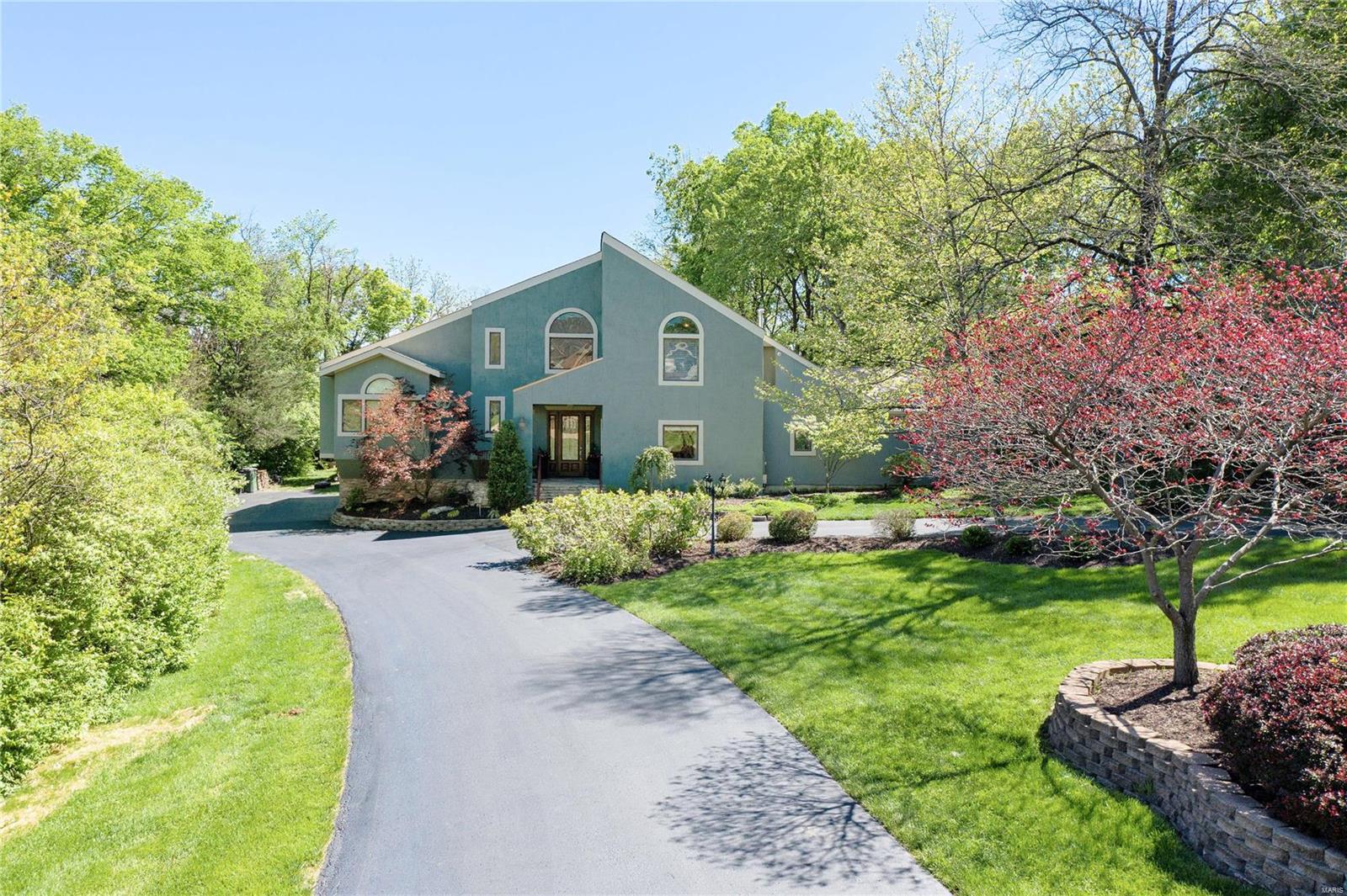 Enjoy privacy and serenity in this exceptional property in prime Town & Country location. The deep circle drive & lush landscaping lead to the remarkable contemporary home that has been beautifully renovated and greatly expanded, now offering almost 6,000 sq ft of very livable space, expansive rooms with cathedral ceilings & enormous windows overlooking patio, large pebble tec pool, gazebo , waterfall & gorgeous grounds.  Mn flr primary suite addition, vaulted ceiling, fireplace, sitting area, lux bath & WI closet. Original primary suite, second luxury bath & 2 WI closets.  All 5 bedrms are ensuite & all updated. Gourmet kitchen beautiful, high end white cabinetry, stainless appliances, center island & breakfast bar & is open to great room & dining room, all with high vaulted ceilings. Family room has amazing wet bar & opens to  solarium & pool bath & walks out to patios & pool.  LL has rec room, exercise room & wine cellar.  3 zones HVAC, oversized 4 car garage! Open Sunday 6/6, 1-3 Additional Rooms: Sun Room, Wine Cellar