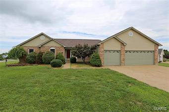 Easy living here in this open floorplan, great room ranch! Finsihed lower level, oversized 3 car garage and a large, level corner lot add to the extra features list!  Newer carpet and fresh interior paint on the main floor too!  The vaulted greatroom is open to the kitchen and dining areas, with a large breakfast bar island, lots of cabinet space and adjoining main floor laundry.  French doors from the breakfast or dining area leads to the deck overlooking the backyard.  The main floor master suite has a large walk in closet, bay window and luxury bathroom with dual sinks, along with separate tub and shower.  The lower level provides added living space with a finished bonus room or den, large family room/rec room area, full bathroom and adequate storage space.  Located in the Greens of Sugar Creek Country Club, just minutes from shopping and highways.  Hurry!