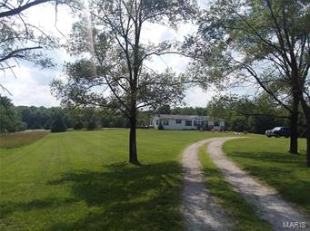 Three bedroom, two bathroom manufactured home on a full unfinished basement. Conveniently located right on the highway and the property consists of 5.66 acres M/L. The home features a large eat-in kitchen with a center island and dining room. Just off the dining room is a large back deck for entertaining. There is lots of opportunity for more finished space in the unfinished basement. The home features a split bedroom design with a large master bedroom and en suite bathroom. The land consists mostly of pasture with some woods and plenty of space to add a shop if needed.