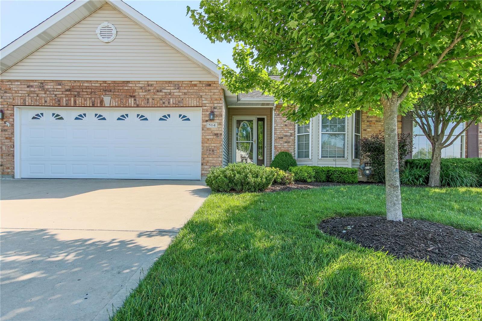 Spectacular, well-maintained villa in desirable Villas at the Crossing. Impressive open vaulted flr plan, amazing sun porch, main flr laundry. Plus, 2,408 total finished sq ft incl huge spectacular walk-out LL w/rec rm, wet bar/wine rack, 2nd fireplace, large egress windows, French drs to bedrm w/walk-in closet, 3rd full bath... perfect for entertaining. Reasonable mo. fees for carefree living yet incredible private lot & inviting patio backs to heavy trees. Handsome curb appeal, brick front, bay window, low-maintenance vinyl siding, enclosed soffits/fascia, thermal windows, manicured landscaping. Streams of natural light, plant shelves, Friese carpet, open staircase, distinctive wall cut-outs, white 6-panel drs/lever handles, 2" blinds, updated light fixtures. Fantastic kitchen open to great rm offers abundant white cabinets w/crown molding, granite counters, pantry, breakfast bar island, gorgeous wood flr. Master suite w/plantation shutters & stately den/built-in shelving. Very Nice! Location: Suburban