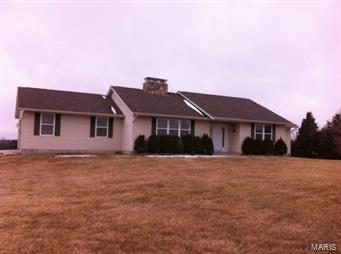 Beautiful Atrium Ranch in peaceful country setting on two acres in Grandview School district. Freshly painted open floor plan features vaulted ceilings. Solid oak hardwood flooring throughout entry, living room, dining room, & kitchen. Floor to ceiling stone fireplace warms the living room. Nice kitchen w oak cabinetry and quartz countertops, black appliances include refrigerator, range, dishwasher, and garbage disposal. Dining room flows with natural light from the skylights and atrium windows. Two bedrooms, and two full baths on main level includes master bedroom suite with french doors to full master bath, complete w linen and walk in closets. Atrium oak staircase leads to unfinished full basement with walk out to large private patio, private back yard backing to pasture and woods, and a cedar playset for the children. Attached two car garage w garage door opener, provides convenient entry from garage into the kitchen.
Available to show beginning July 2.