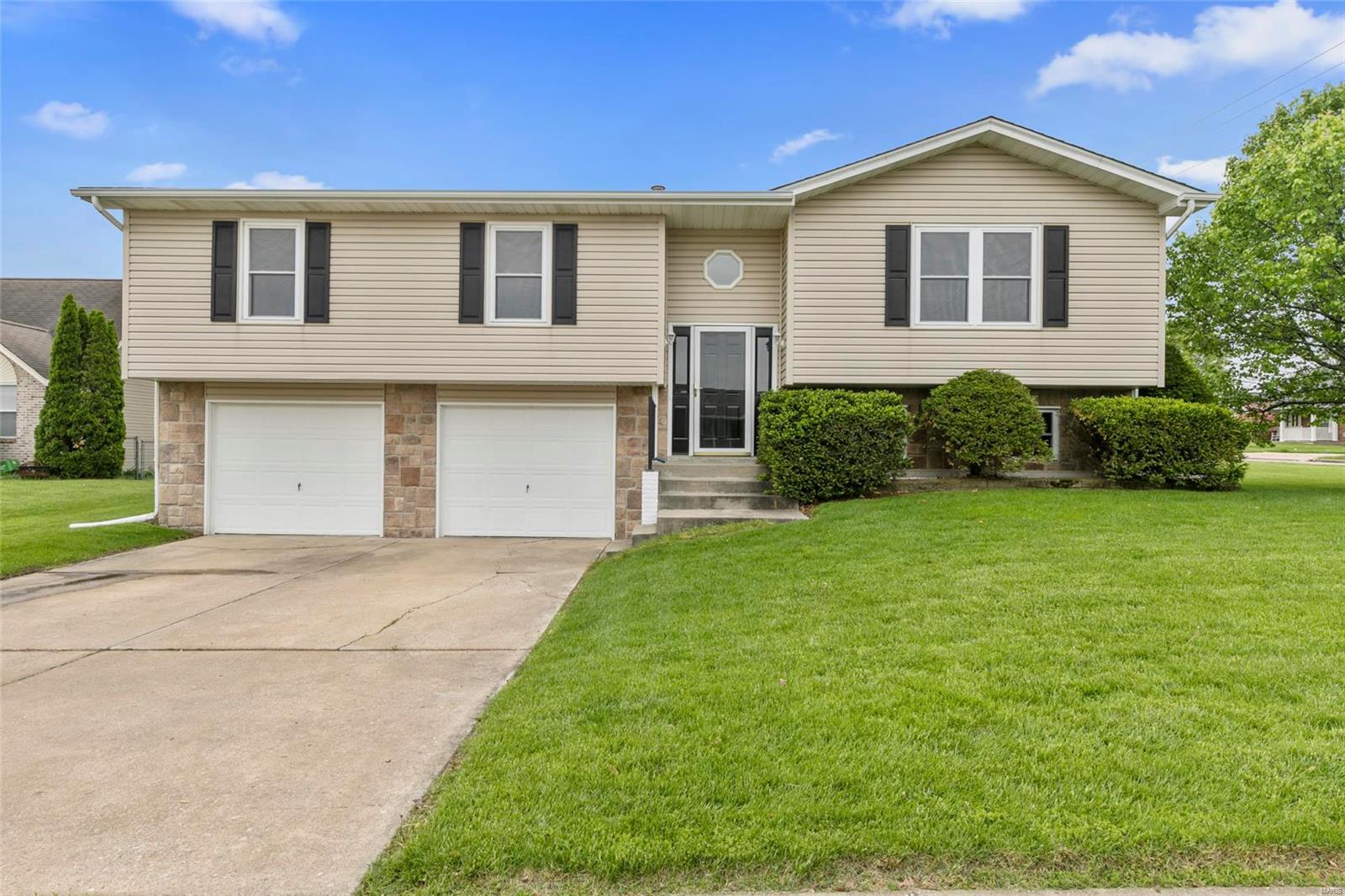 Welcome home to this nicely updated 3 bedroom, 2 bathroom split level! The great room offers vinyl wood plank flooring. The kitchen boasts vinyl wood plank flooring, custom cabinetry, granite countertops and designer tile backsplash. All 3 bedrooms are nicely updated with new carpeting.  The bathrooms are both updated with new ceramic tile floors, design tile backsplash and all new plumbing fixtures.  Situated on a corner lot in a great neighborhood, the spacious, fenced yard offer beautiful landscaping, a lush lawn and ample space to play!  Other features include: a 2 car garage, new roof (2019) and new deck, all new lighting, all new doors and wall and trim paint throughout!  With all these spectacular updates, this home is move in ready!!  Located within Wentzville city limits and in the Wentzville school district. Minutes from shopping, restaurants and entertainment!