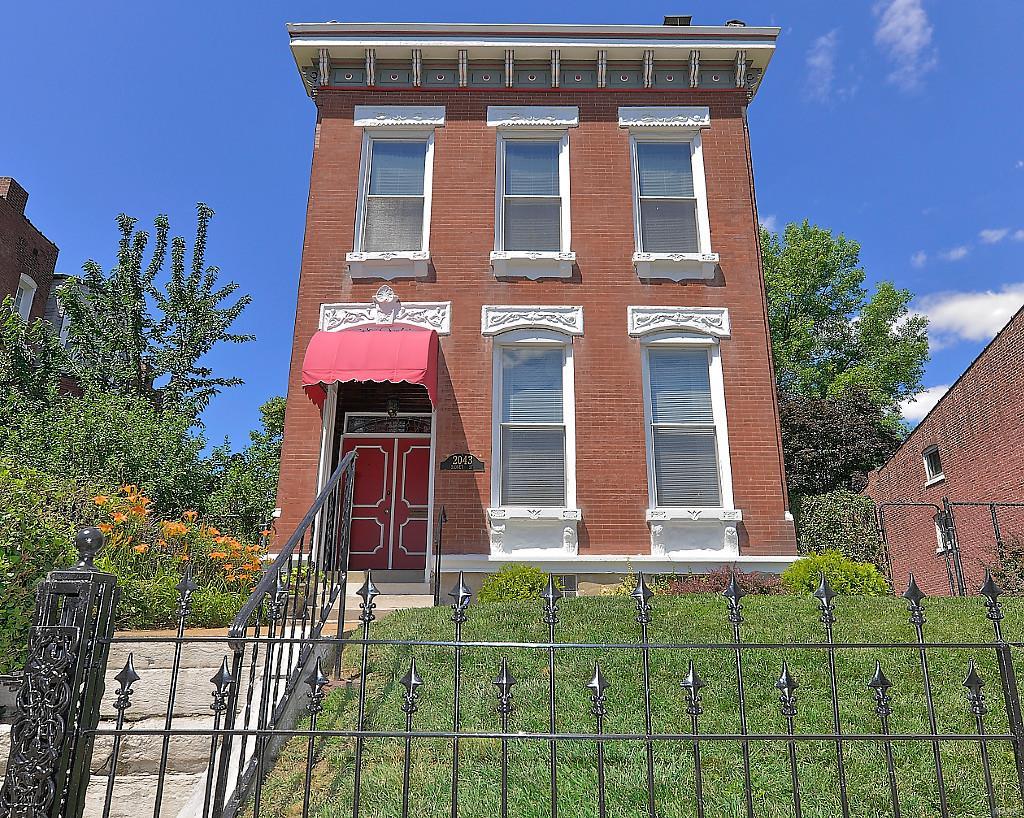 A Benton Park Unique find**Granite steps lead to this lovely home situated on a double lot w/ 3 car off street parking. 3 bedrooms, 2 full baths, 2 half baths. Main level is open with a formal living(pocket doors) and dining area w/ triple window bay.  Large Kitchen(center island, built ins, breakfast bar) adjoins a cozy family room & large custom deck (lots of outdoor space)**Second story has  two master suites.  One has a luxury bath (17 x 9) with whirlpool tub, makeup space and the other bedroom is extra deep with an office/den and full bath both are separated by a convenient second floor laundry***Open 3rd floor bedroom & half bath with door opening up to the roof with a drop dead view!   Lotss of natural lighting, wood doors & trim, high ceilings, newer roof, tuckpointing, & electrical service, Well maintained and lots of living space.  Large basement, perfect for storage and hobby area. Second and third level hvac new in 2017** main flr & basement new ac**Electronic fence