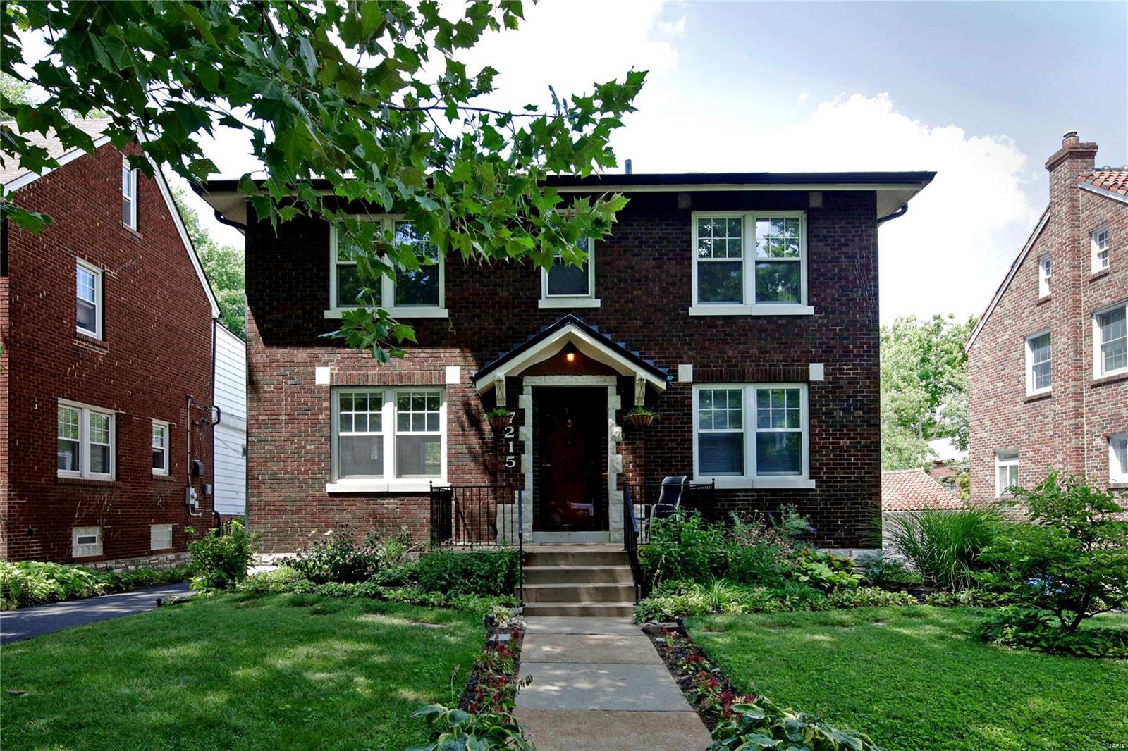 This center entry 2-story brick home features beautifully proportioned scale & updated living. The flow on the main level is perfectly suited for effortless entertaining. A well sized living room with fireplace & inviting dining room leads perfectly into the open & updated Euro-style kitchen where  contemporary & classical elements meld seamlessly. Solid counters, maple cabinetry & stainless appliances will excite the inner chef and makes for an idyllic spot for friends and family to gather. Rich wood floors in the LR & DR & custom built-ins in the DR create a warm backdrop for your personal style. A powder rm completes the main level. The 2nd level offers 3 bedrooms, an updated full bathroom plus a bonus area. A recreation room & abundant storage in the lower level is the perfect spot for a home office or hobby area. An enchanted garage roof top balcony overlooking the backyard makes for spectacular entertaining. Easy access to I/64 & I/170, Washington University and Downtown Clayton.