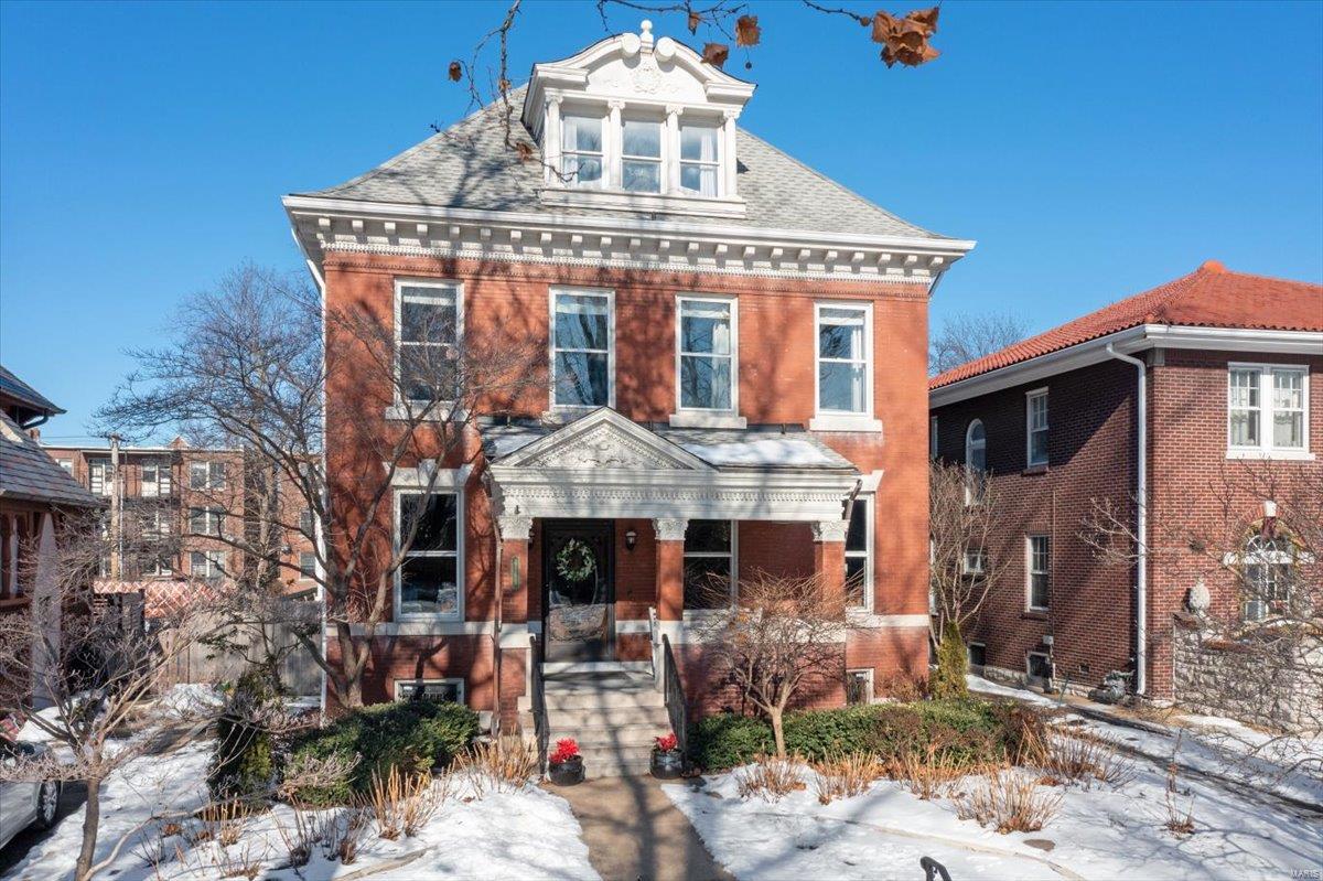 With elegance & a story to tell, we present 4169 Flora Place. This soaring 2.5 story home is filled with decades of history and architecture. The grand entry hall greets you with intricate detail. From the fireplaces hand carved by a German woodworker traveling here during the World’s Fair, to the art glass windows representing eternal life.  Jefferson windows, wainscoting, hardwood floors & beamed ceilings in immaculate condition, yet, the modern luxuries are not lacking.  Exquisite kitchen recently renovated with a handcrafted custom island, marble flooring, top of the line appliances + a butler’s pantry. Updated Primary bathroom and custom closet with quartz countertops. Host the ultimate gathering with a dream outdoor space: Fountain, wet bar + front, back & side porches. Speaking of hosting, the 3rd floor in it’s early years was used as a ballroom, now the perfect place to get cozy with a good book! Walk to Fiddlehead Fern, Sasha’s Wine bar, Tower Grove Park & much more!