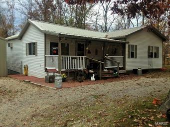 CUTE! CUTE! LAKE property on 5 lots (1.5+ ACRES)! 24 X 30 detached garage with concrete floor and electric. Home is all electric, central heat pump, hardwood floors, metal roof, fenced back yard, MANY improvements! VERY ENERGY EFFICIENT!! Great home for the price!!! Move in now and enjoy the beautiful lake all summer!