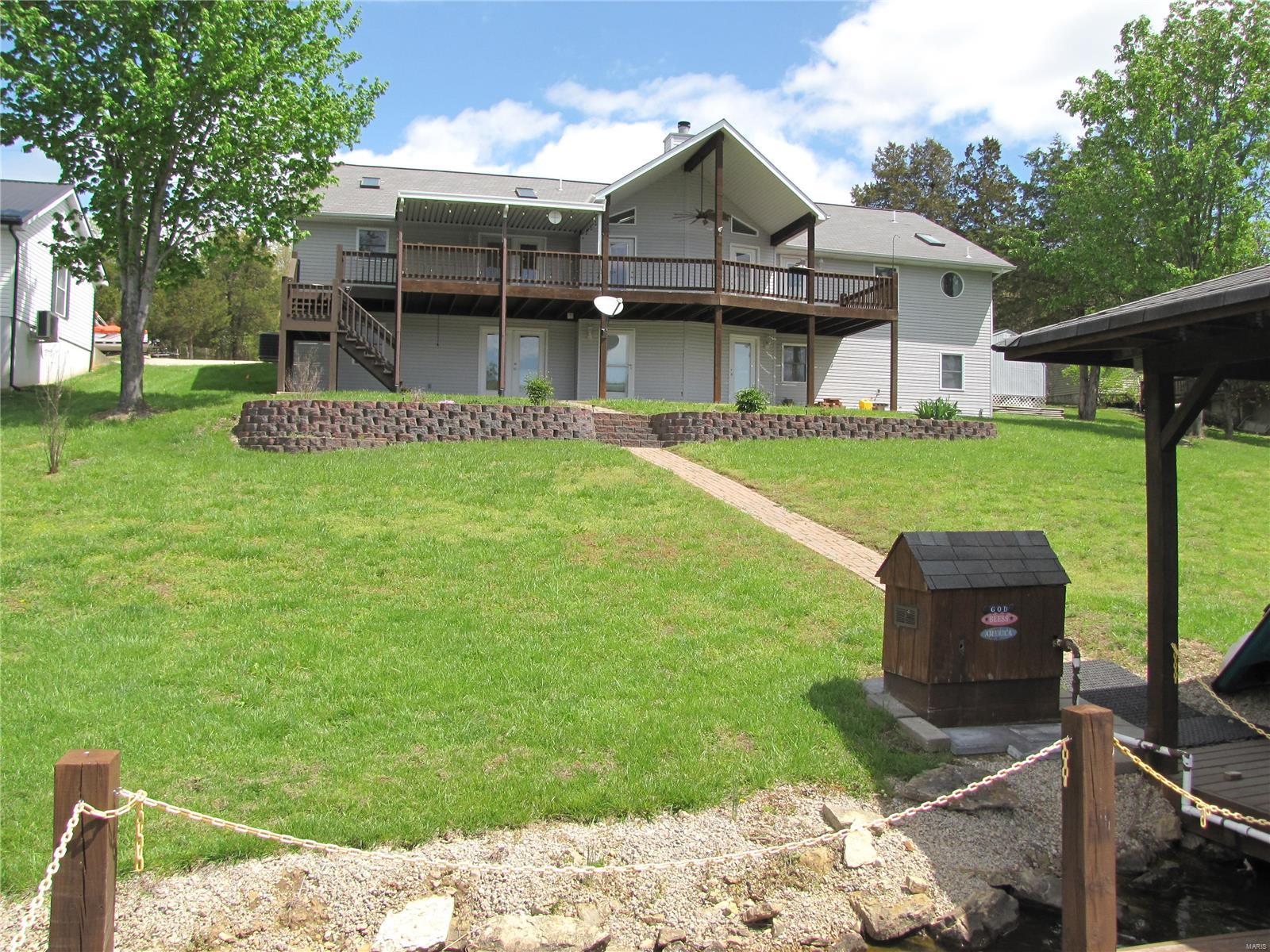 Beautiful and well maintained 6 bedroom 3 bath lake-front home on Lake Lafitte (Ski Lake).  Covered boat slip with storage and sun deck in "No Wake" zone.  Aprox 10ft depth at end of dock with 30+ pound catfish in summer right at the dock.  Huge open floor plan with vaulted ceilings ready to entertain and enjoy lake life.  Newer hot water heater, Covered deck, and covered patio overlooking spectacular sunsets, Gas fireplace with blower and custom stonework, newer carrier furnace with humidifier, Newer carpet, and barn-wood colored floors, detached shop, oversized 2 car garage with workbench, home warranty provided, central vac, main floor laundry, pantry, TONS of storage space for all your lake toys, several bedrooms would make great offices areas or dens, Large Master suite with door to deck and custom master bath with Jacuzzi tub and walk-in shower, lake water pump to water garden or landscaping. There is much much more to this custom built home to list.  Call Today !!