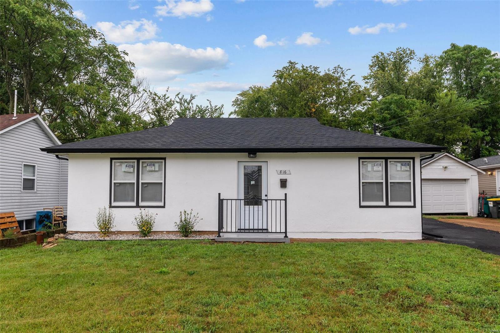 Exciting New Listing in Webster Groves! This fully remodeled ranch-style home offers over 1,100 square feet of modern living with 3 bedrooms and 2 stunning bathrooms. The kitchen showcases gorgeous quartz countertops, custom cabinetry, and all-new appliances, perfectly designed for both style and functionality. Throughout the house, you'll find luxury vinyl plank flooring, giving the home a sleek and durable feel. Both bathrooms feature matching custom tile work for a cohesive, elegant look. The open floor plan flows seamlessly into a spacious dining room, perfect for family gatherings or entertaining guests. With a brand-new roof and gutters you can take the guesswork out of future major expenses. Outside, enjoy a spacious gated backyard ideal for relaxation or play, along with a large detached 2-car garage for extra storage or workspace. Located in the heart of Webster Groves, this home offers unbeatable value at a fantastic price point, and it’s move-in ready—don’t miss out!