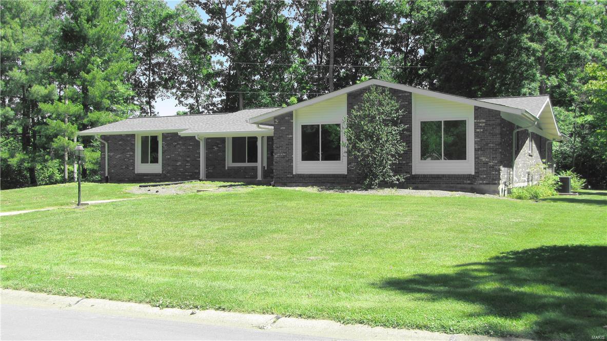 Remodeled, home with open floor plan, hardwood floors throughout, Spa-like master bath with private water closet, oversized walk in tiled shower, soaking tub, dual vanities, granite counter tops and makeup vanity. New kitchen cabinets, granite counter, Travertine back splash, microwave, gas range/oven. O/S side by side refrigerator/freezer. Large granite topped island with seating for five. MFL with granite, new cabinetry and tile floor. Huge Master bedroom walk in closet. Master Bedroom with natural light and beautiful private wooded lot. Family room with fireplace opens to kitchen for family living. Living room for media or social activity. Natural light through new high efficiency windows in every room! Granite vanity, 10 feet long with dual sinks in Jack & Jill bath. Tub and shower with custom tile surround, tile floors. Bedrooms have large closets, two linen closets. Brick home on half acre lot. Backs to Millennium Park, Quiet neighborhood, this is NO Smoking and NO Pet property.